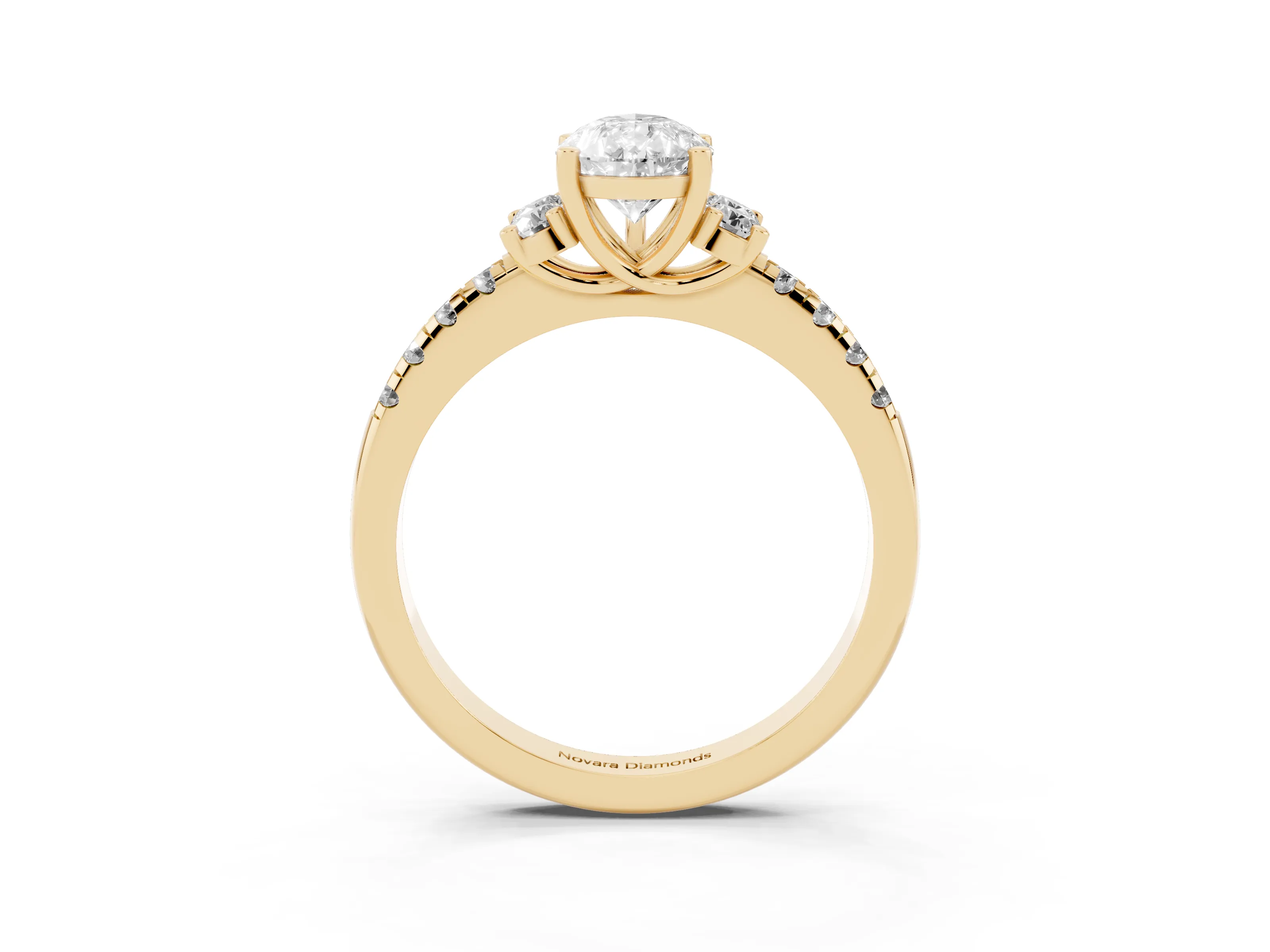 Pear Cut Diamond Three-Stone Pavé Ring Set in Yellow gold with Prong Setting