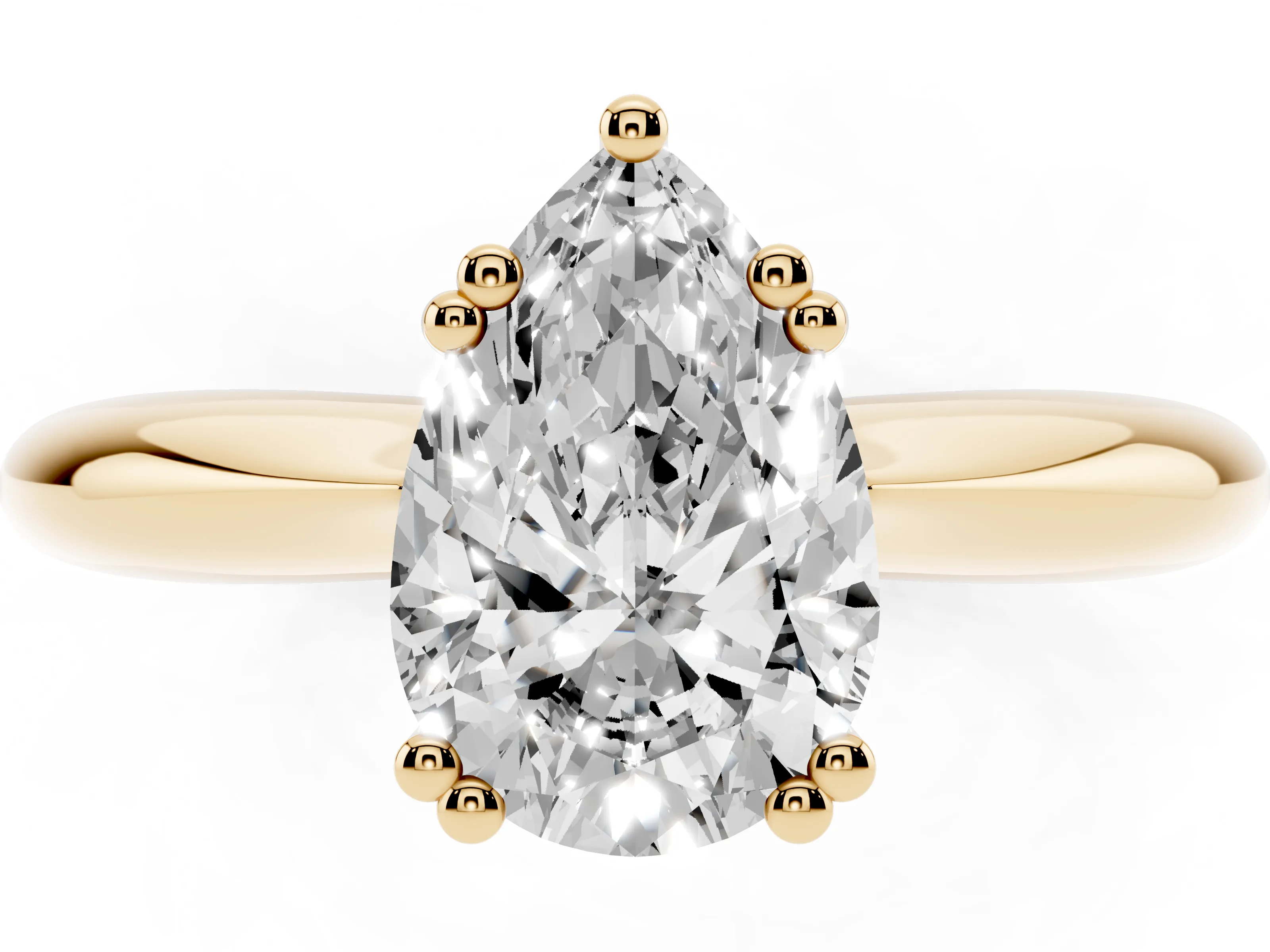 Pear Cut Diamond Solitaire Engagement Ring Set in Yellow gold with Tapered Band and Prong Setting