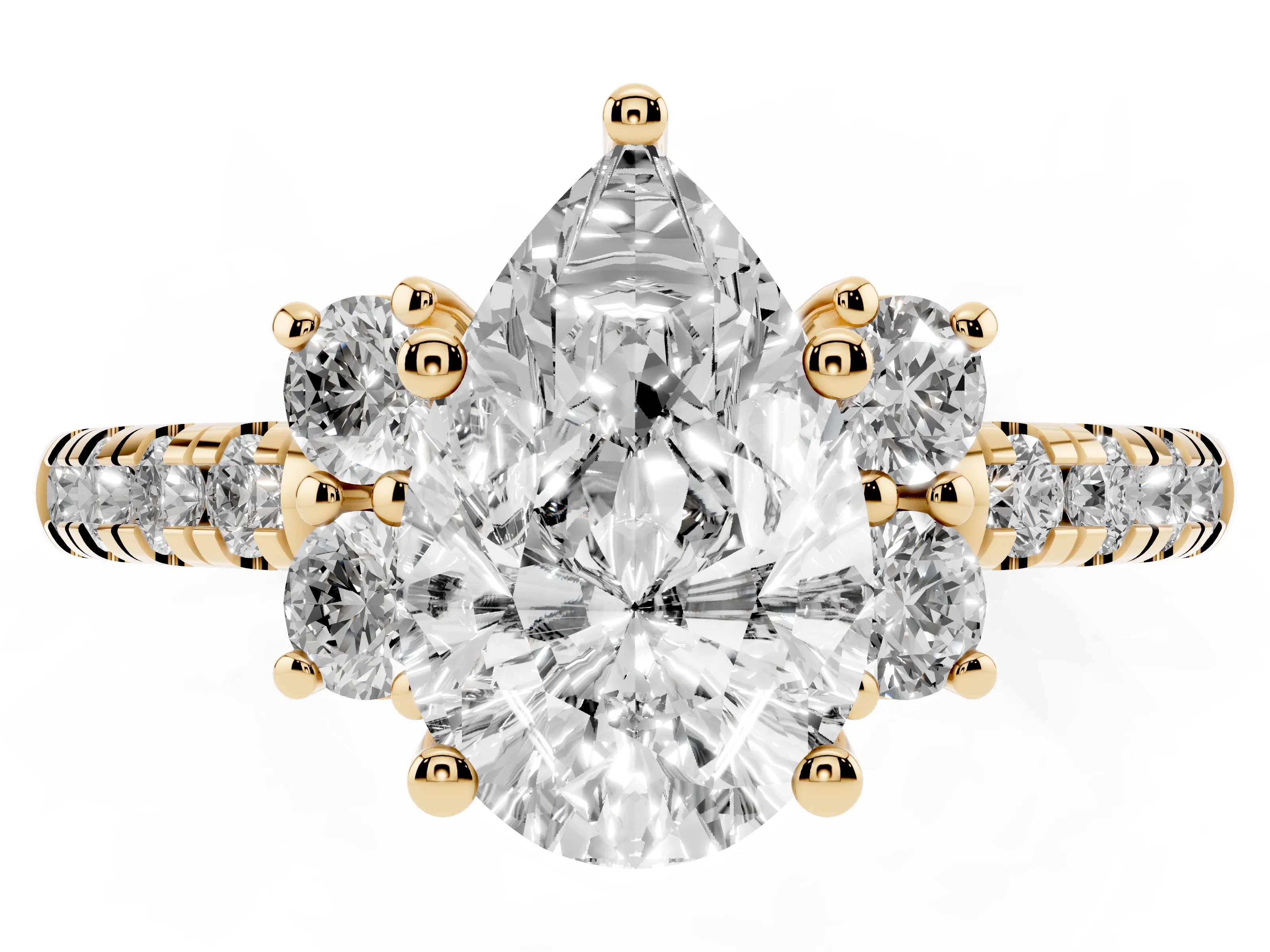 Pear Cut Diamond Three-Stone Pavé Ring Set in Yellow gold with Prong Setting