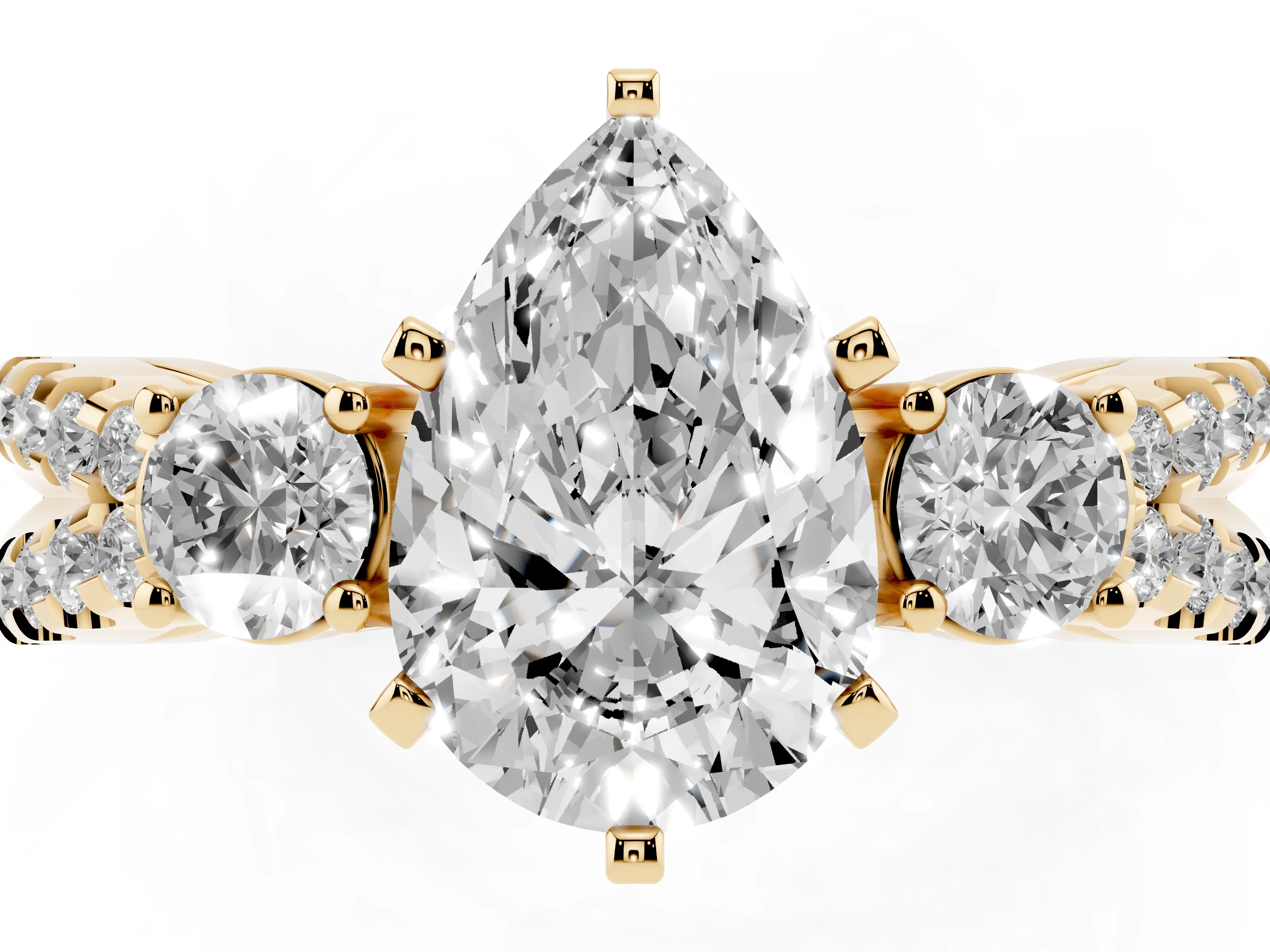 Pear Cut Diamond Three-Stone Ring Set in Yellow gold with Pavé Split Shank and Prong Setting