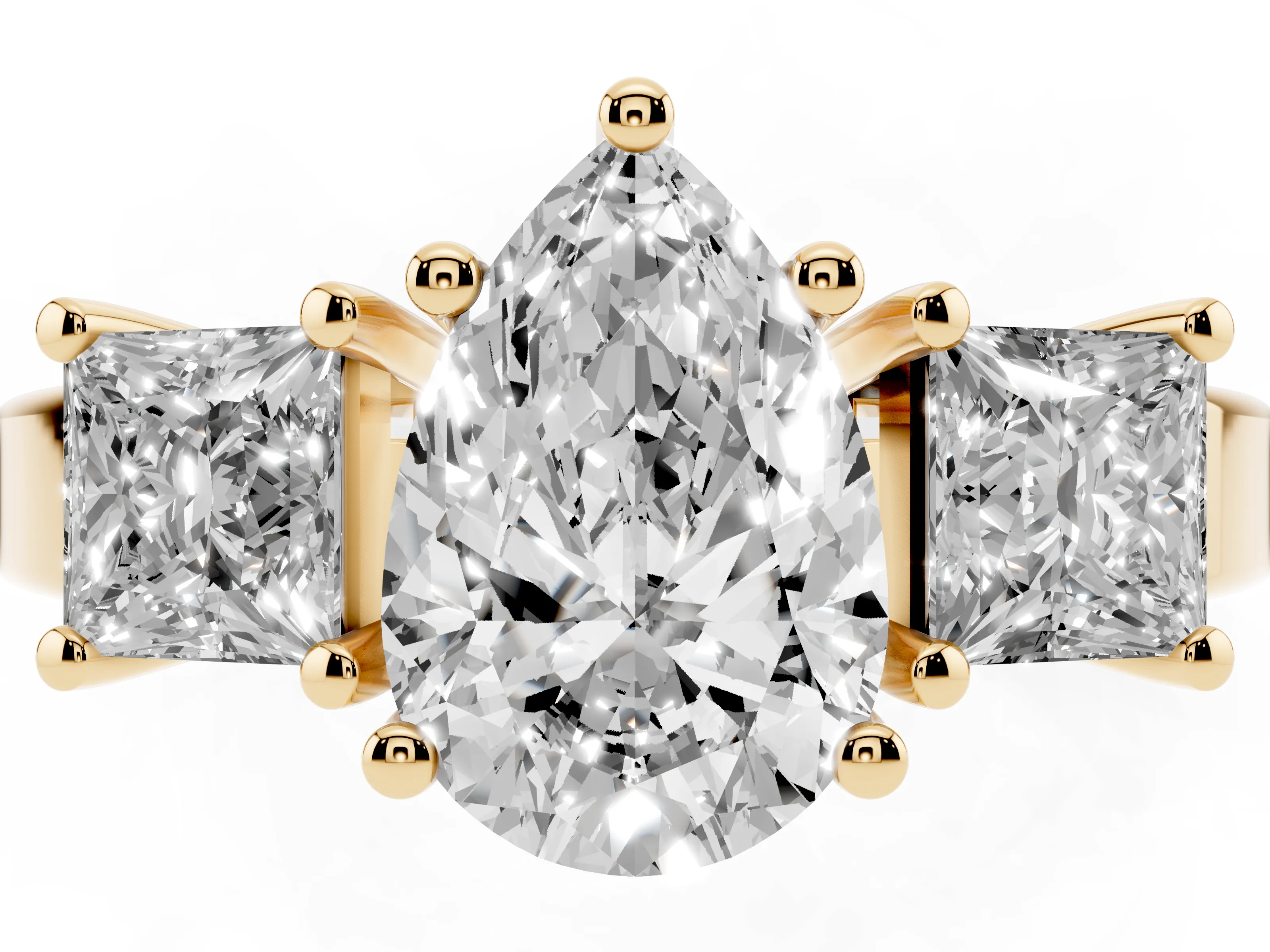 Three-Stone Pear Cut Diamond Solitaire Ring Set in Yellow gold with Prong Setting