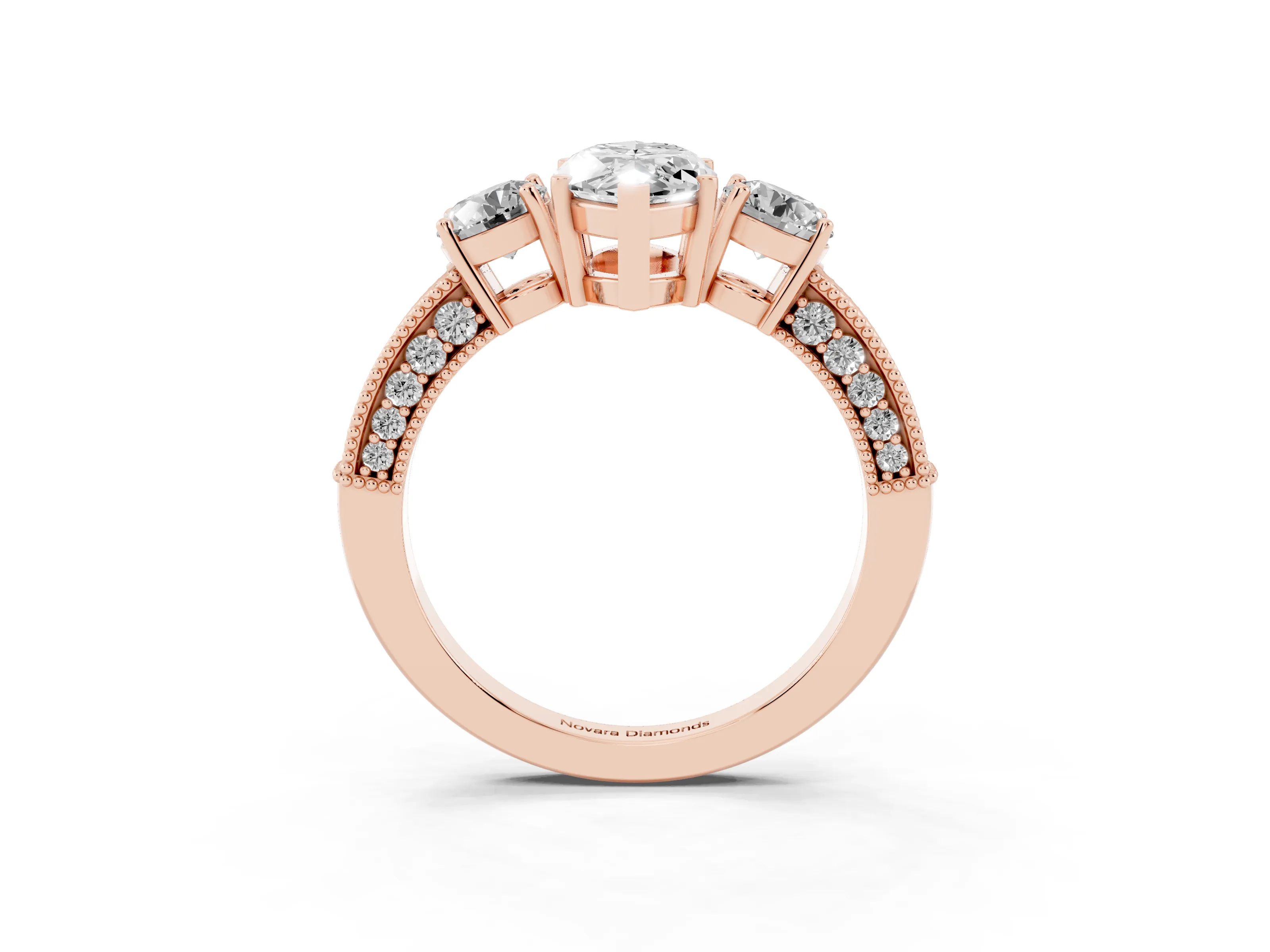 Marquise Cut Diamond Three-Stone Ring Set in Rose gold with Round Side Stones and Pavé Band