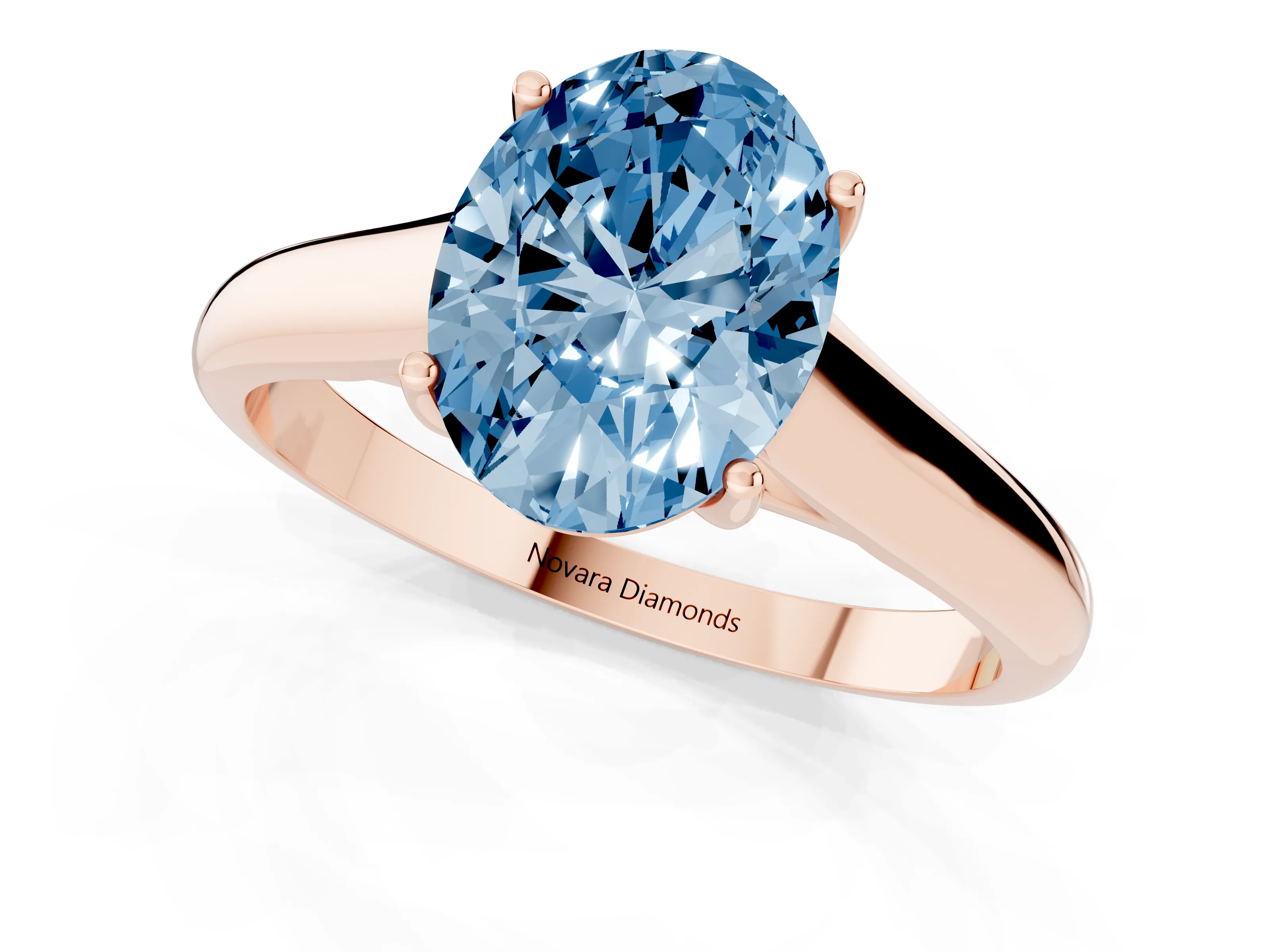Fancy Blue Oval Cut Diamond Solitaire Engagement Ring Set in Rose gold with Subtly Tapered Band and Prong Setting