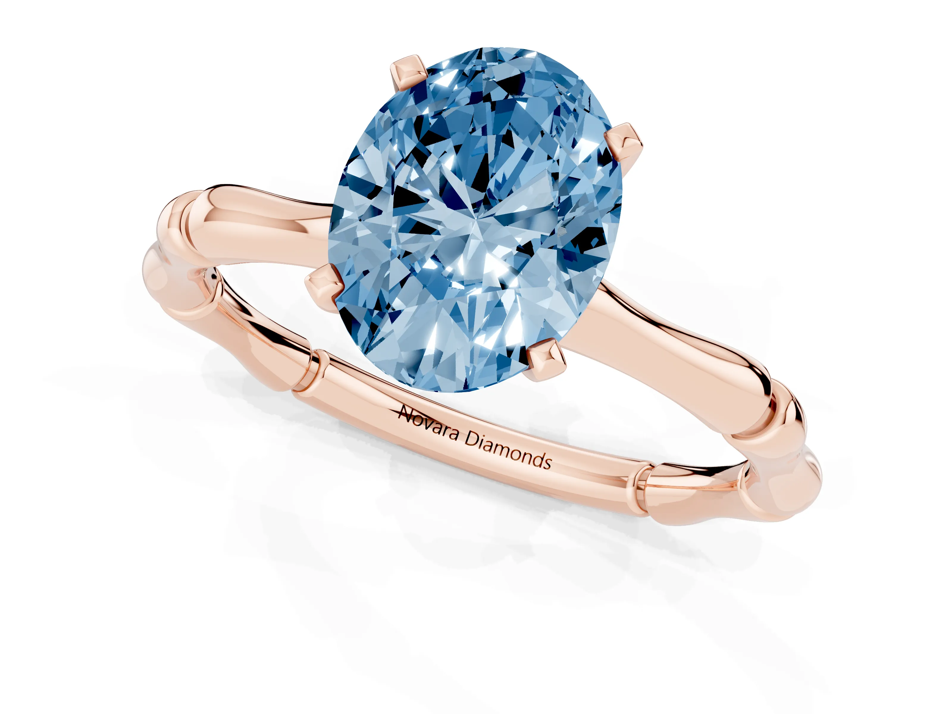 Fancy Blue Oval Cut Diamond Solitaire Ring Set in Rose gold with Bamboo Band and Prong Setting