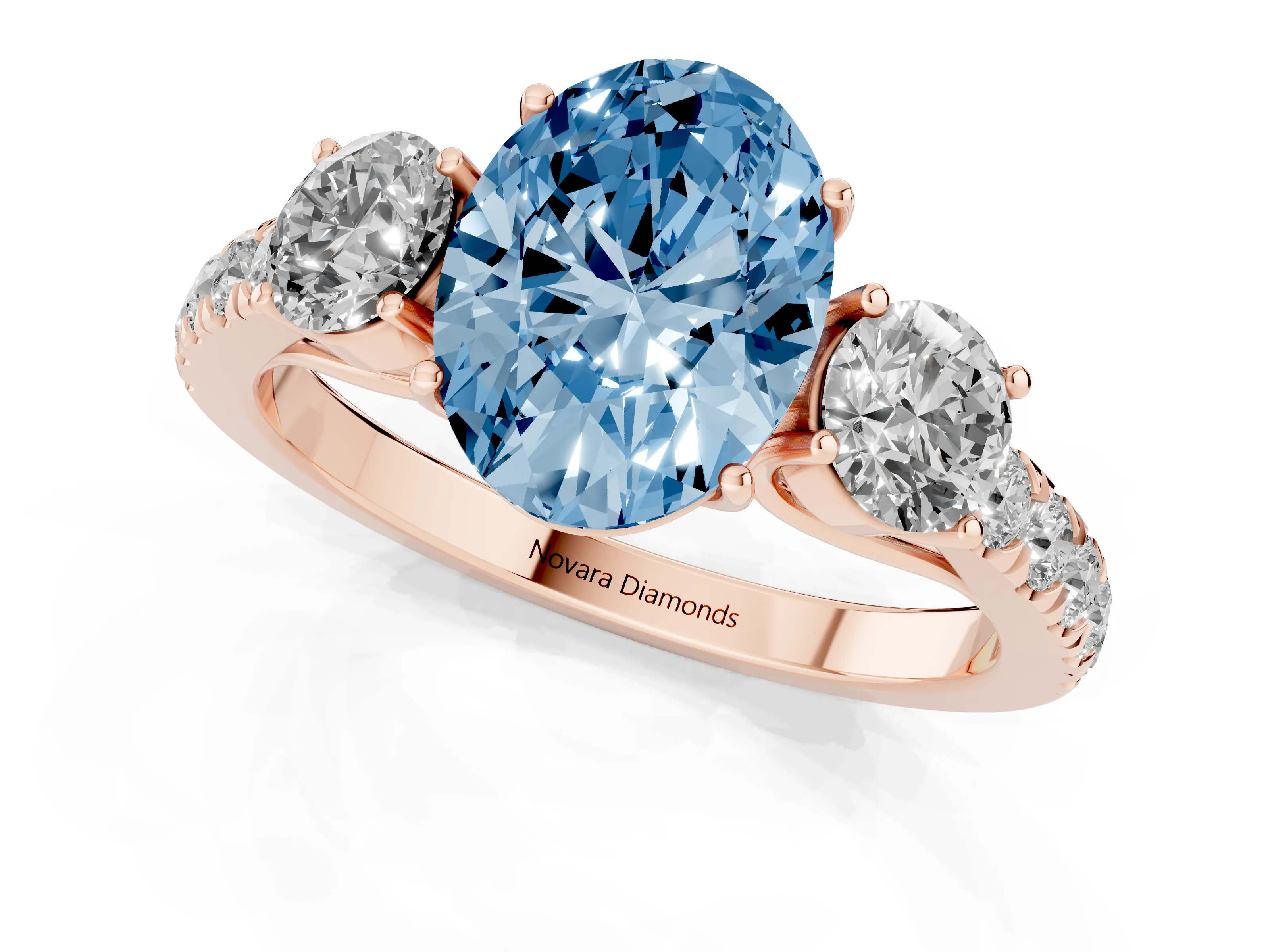 Fancy Blue Oval Cut Diamond Three-Stone Ring Set in Rose gold with Round Side Stones and Delicate Pavé Band