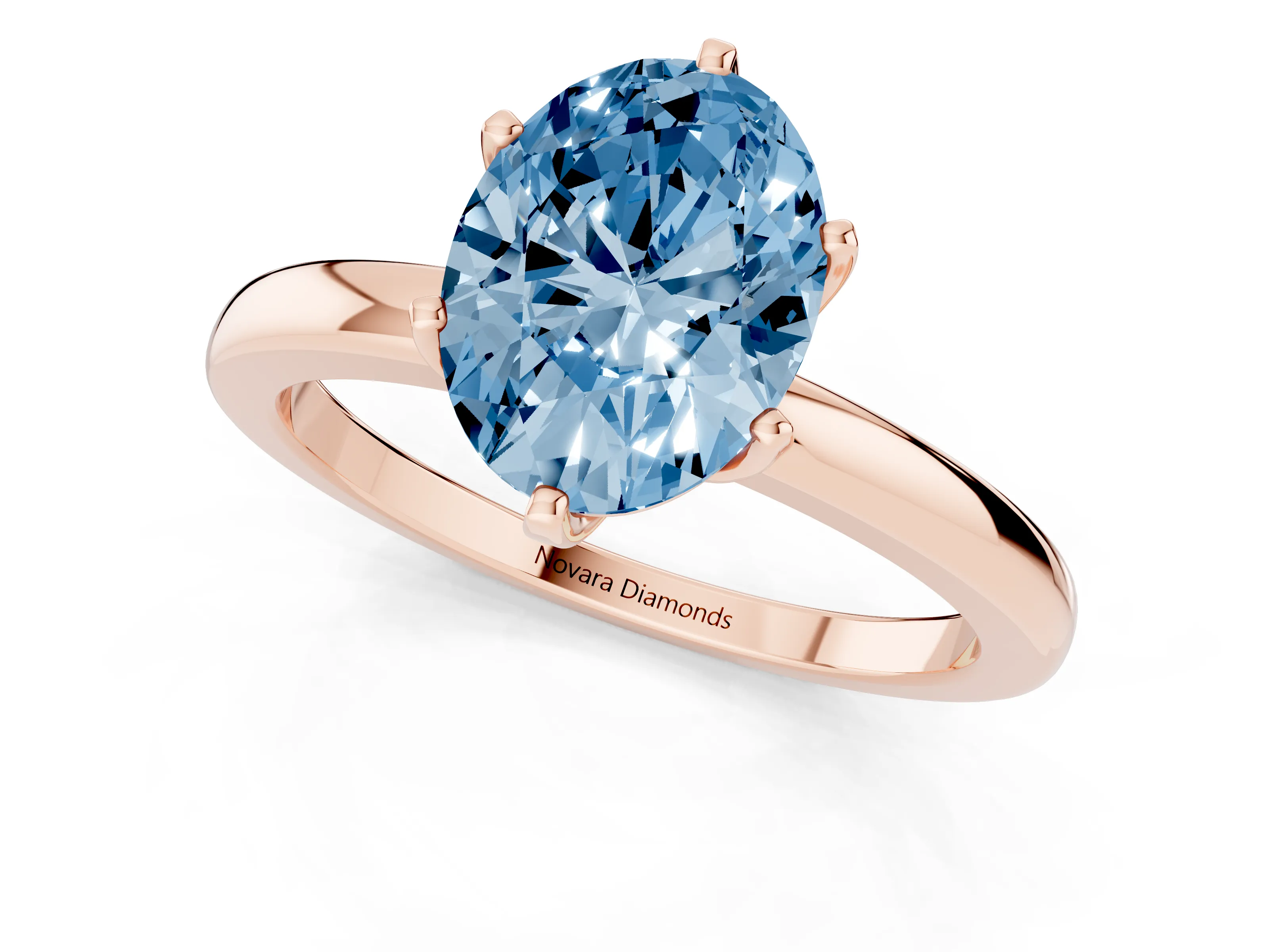 Fancy Blue Oval Cut Diamond Solitaire Ring Set in Rose gold with Raised Prong Setting on a Classic Band