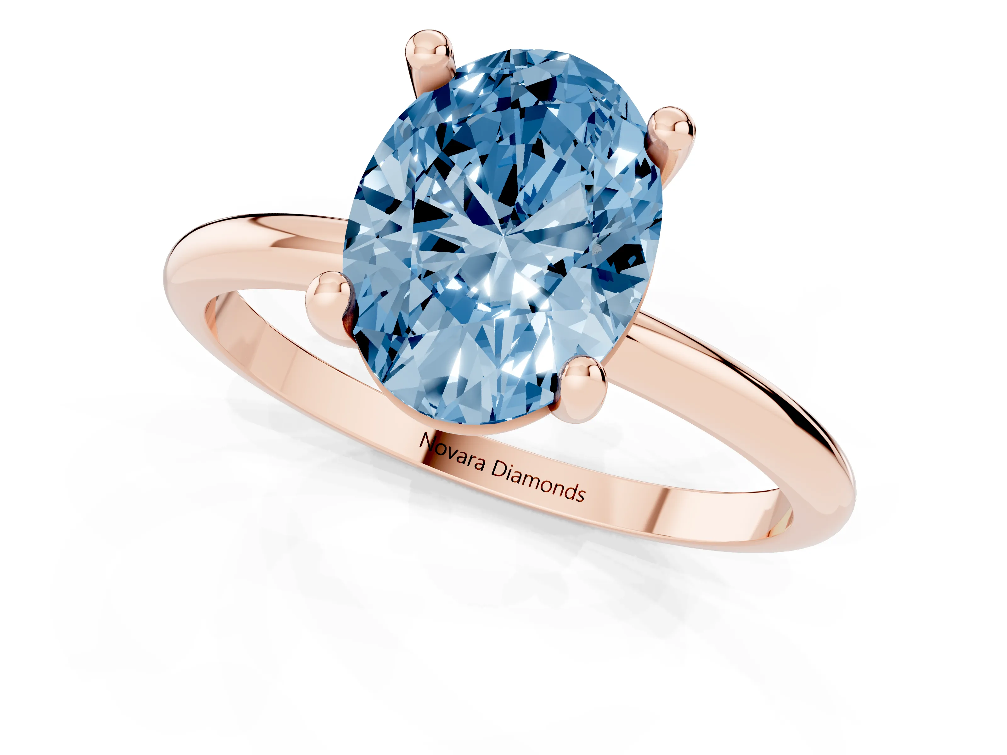 Fancy Blue Oval Cut Diamond Solitaire Ring Set in Rose gold with Secure Prong Setting on a Classic Band