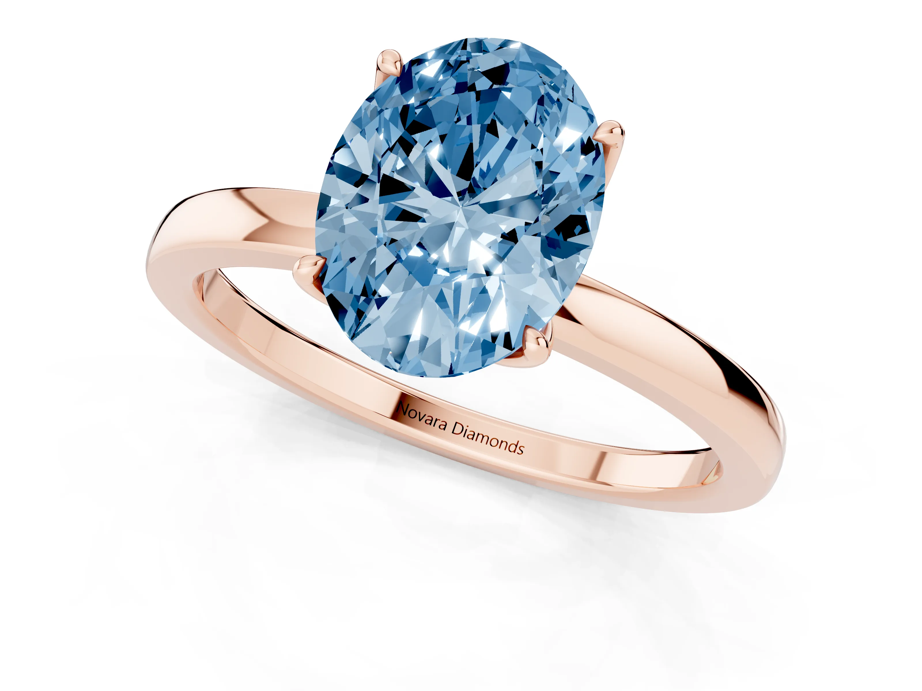 Fancy Blue Oval Cut Diamond Solitaire Ring Set in Rose gold with Prong Setting and Thin Polished Band