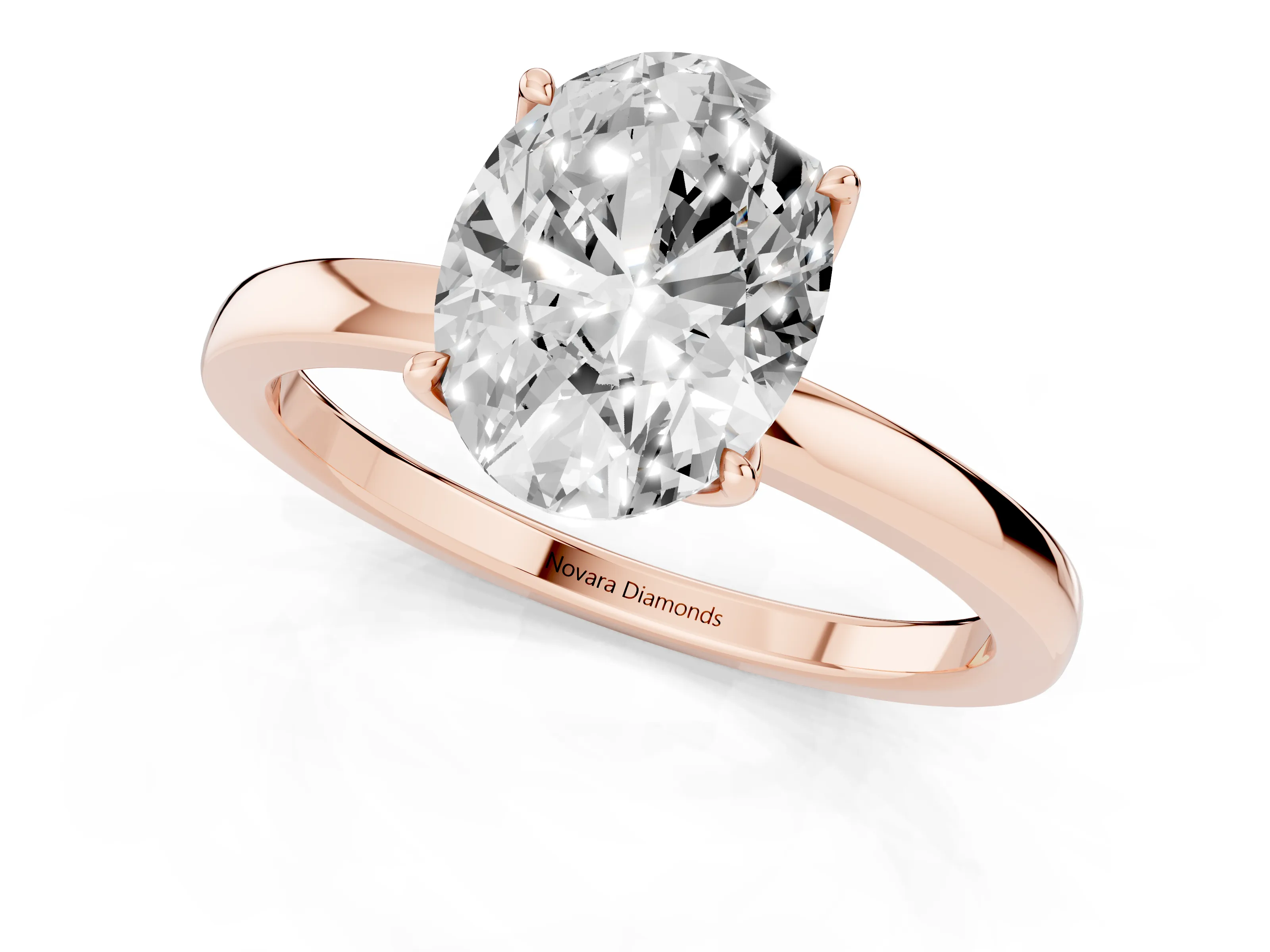 Oval Cut Diamond Solitaire Ring Set in Rose gold with Prong Setting and Thin Polished Band