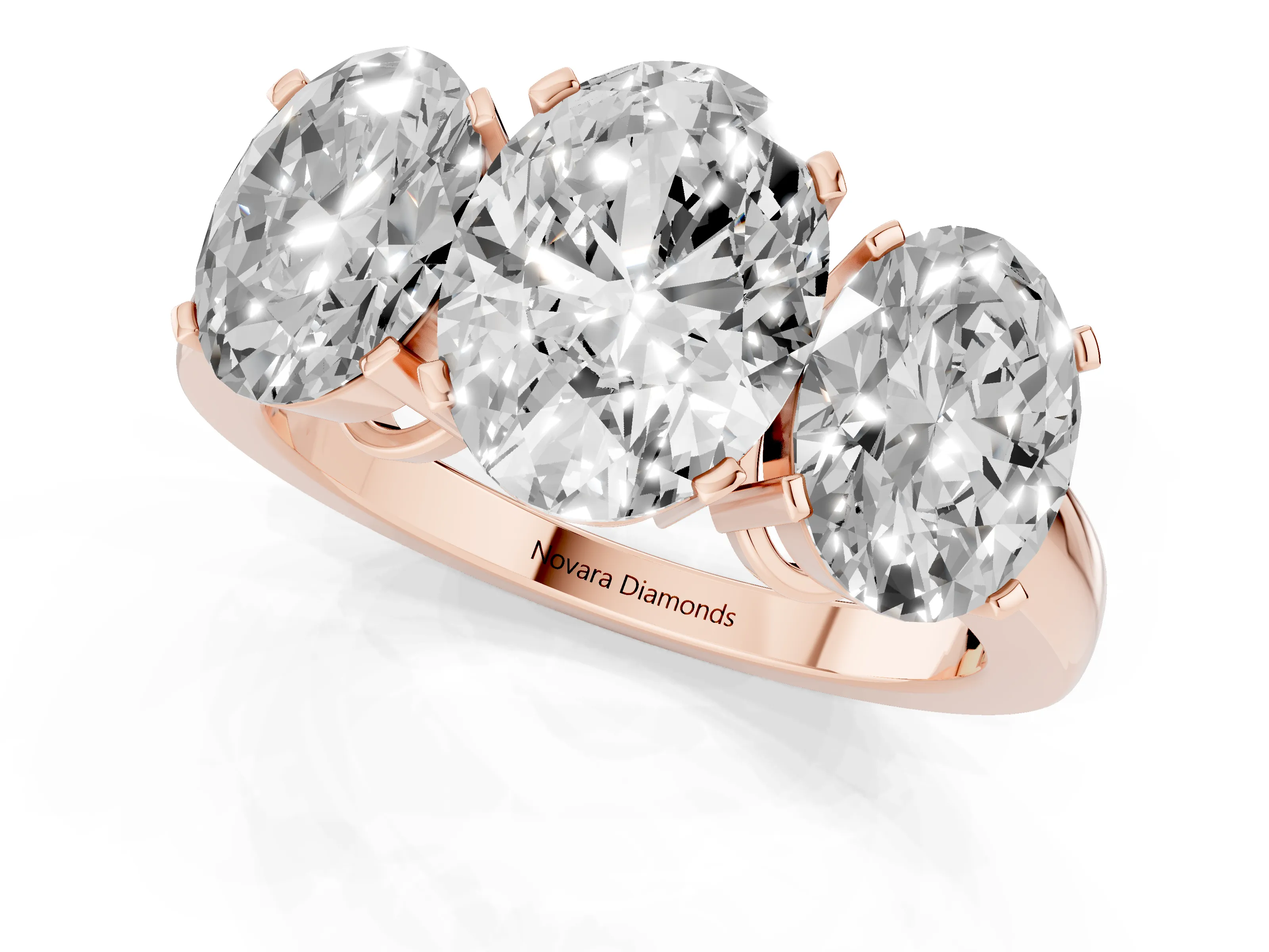 Oval Cut Diamond Three-Stone Ring Set in Rose gold with Channel-Set Band and Prong Settings