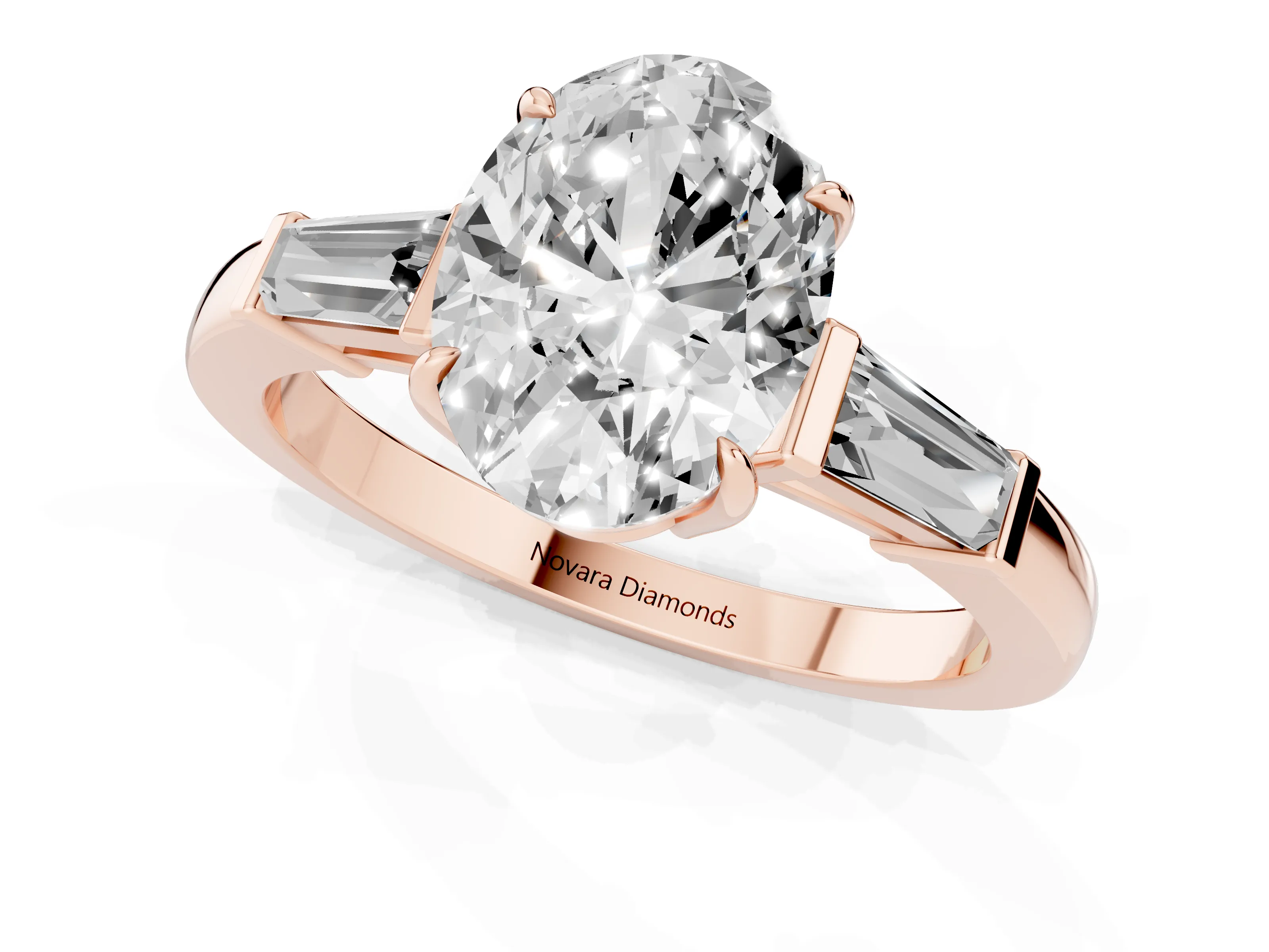 Oval Cut Diamond Three-Stone Ring Set in Rose gold with Tapered Baguette Side Stones and Prong Setting