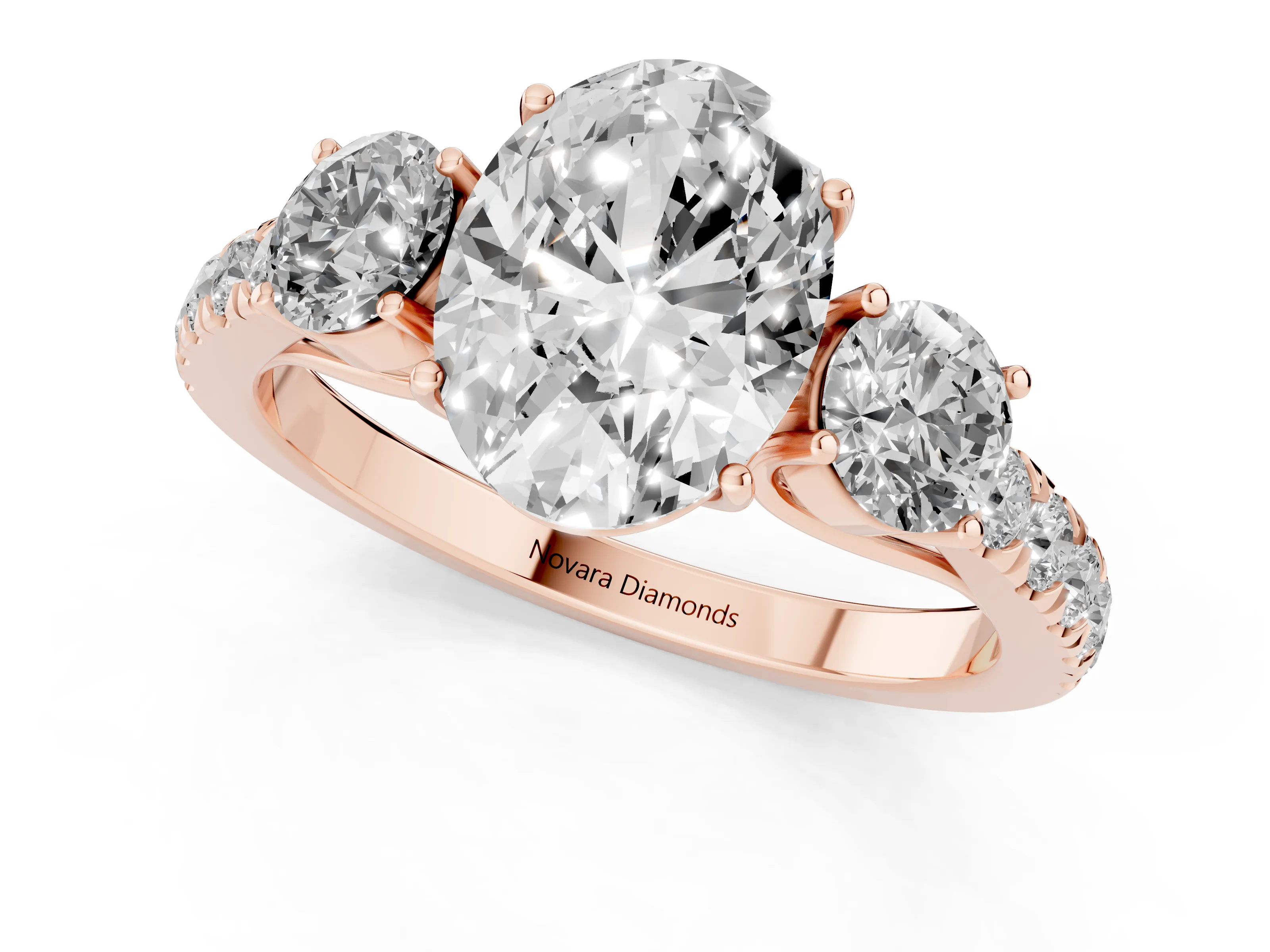 Oval Cut Diamond Three-Stone Ring Set in Rose gold with Round Side Stones and Delicate Pavé Band