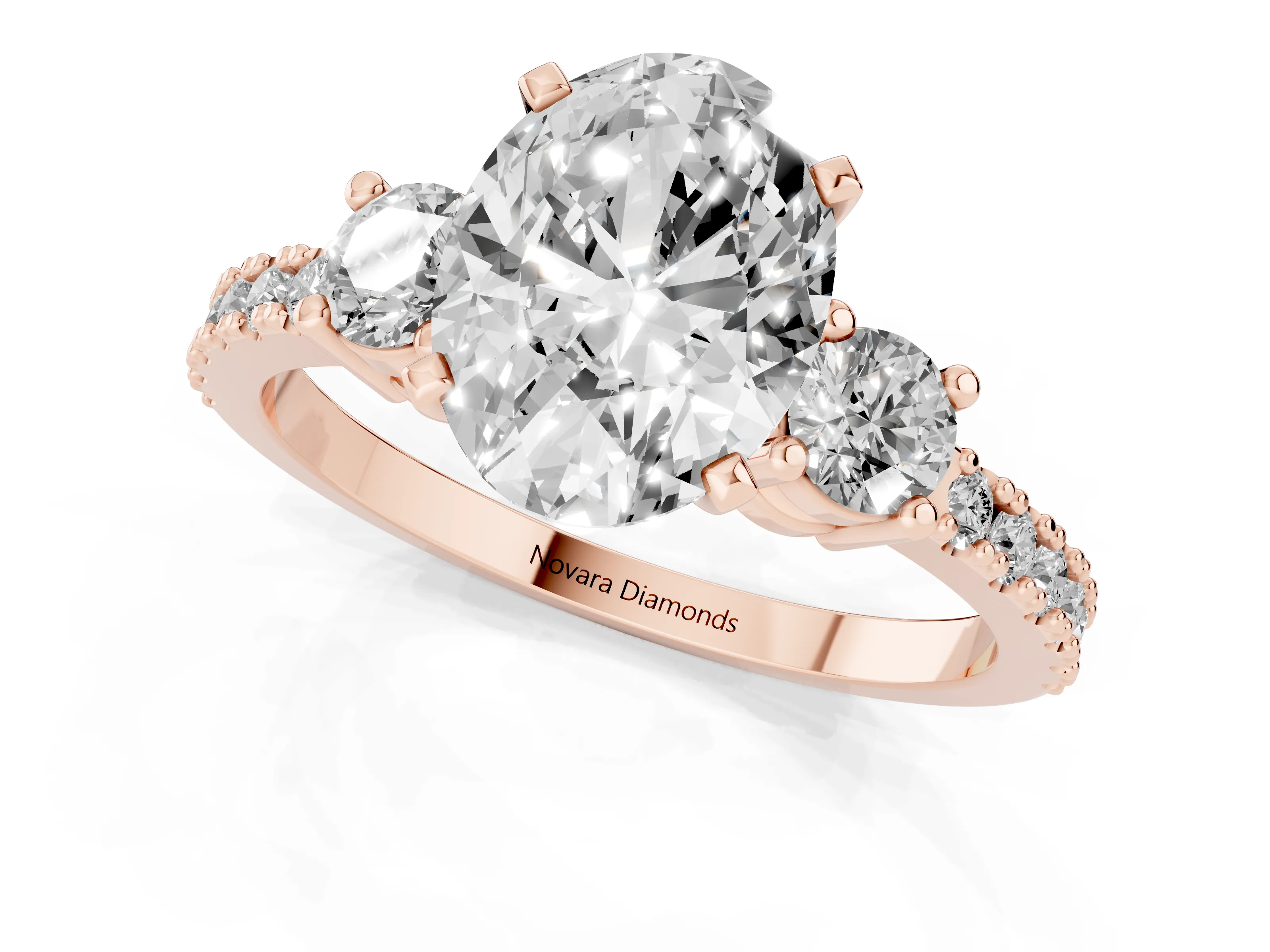 Three-Stone Oval Cut Diamond Pavé Band Ring Set in Rose gold with Prong Setting
