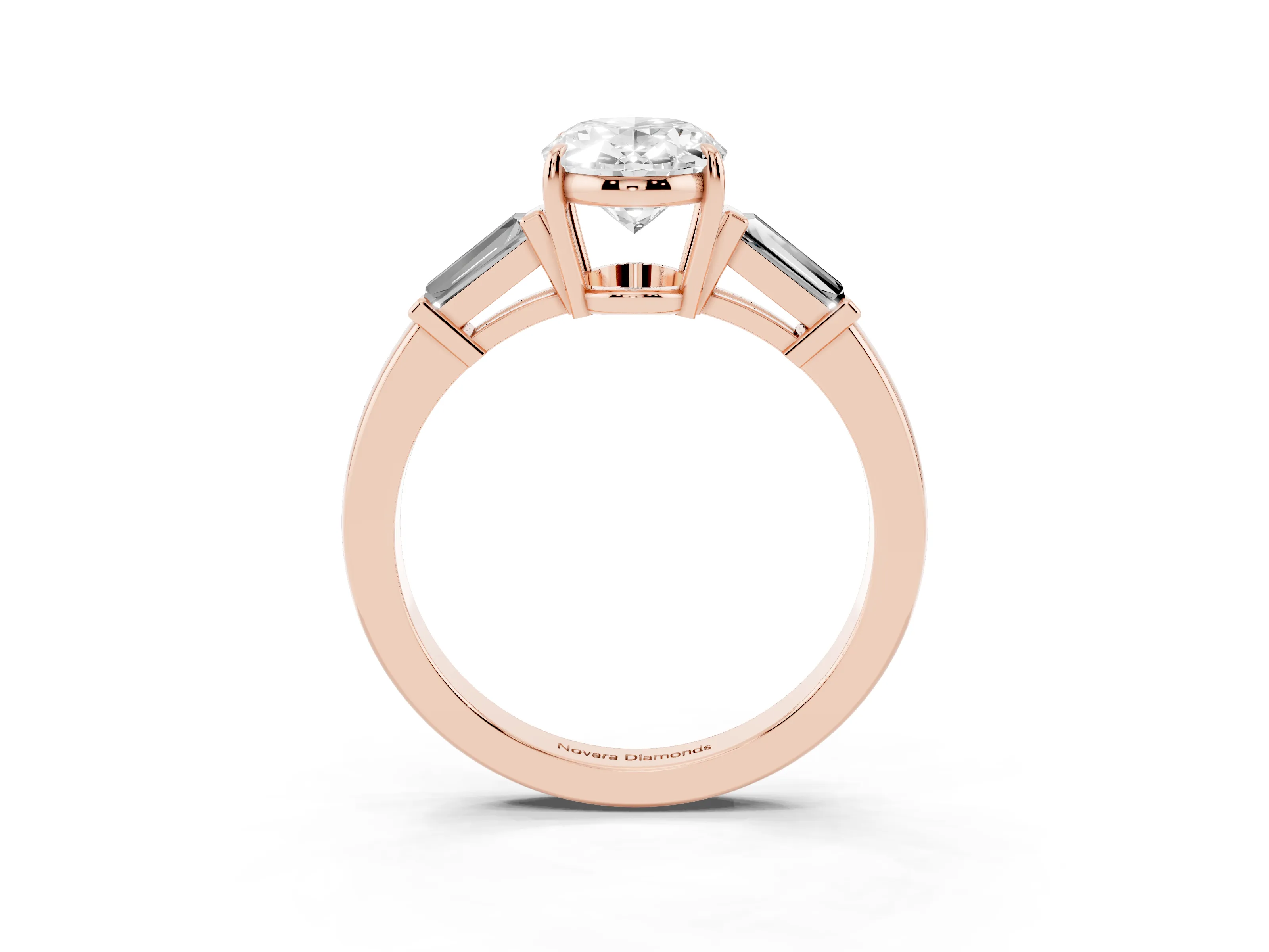 Oval Cut Diamond Three-Stone Ring Set in Rose gold with Tapered Baguette Side Stones and Prong Setting
