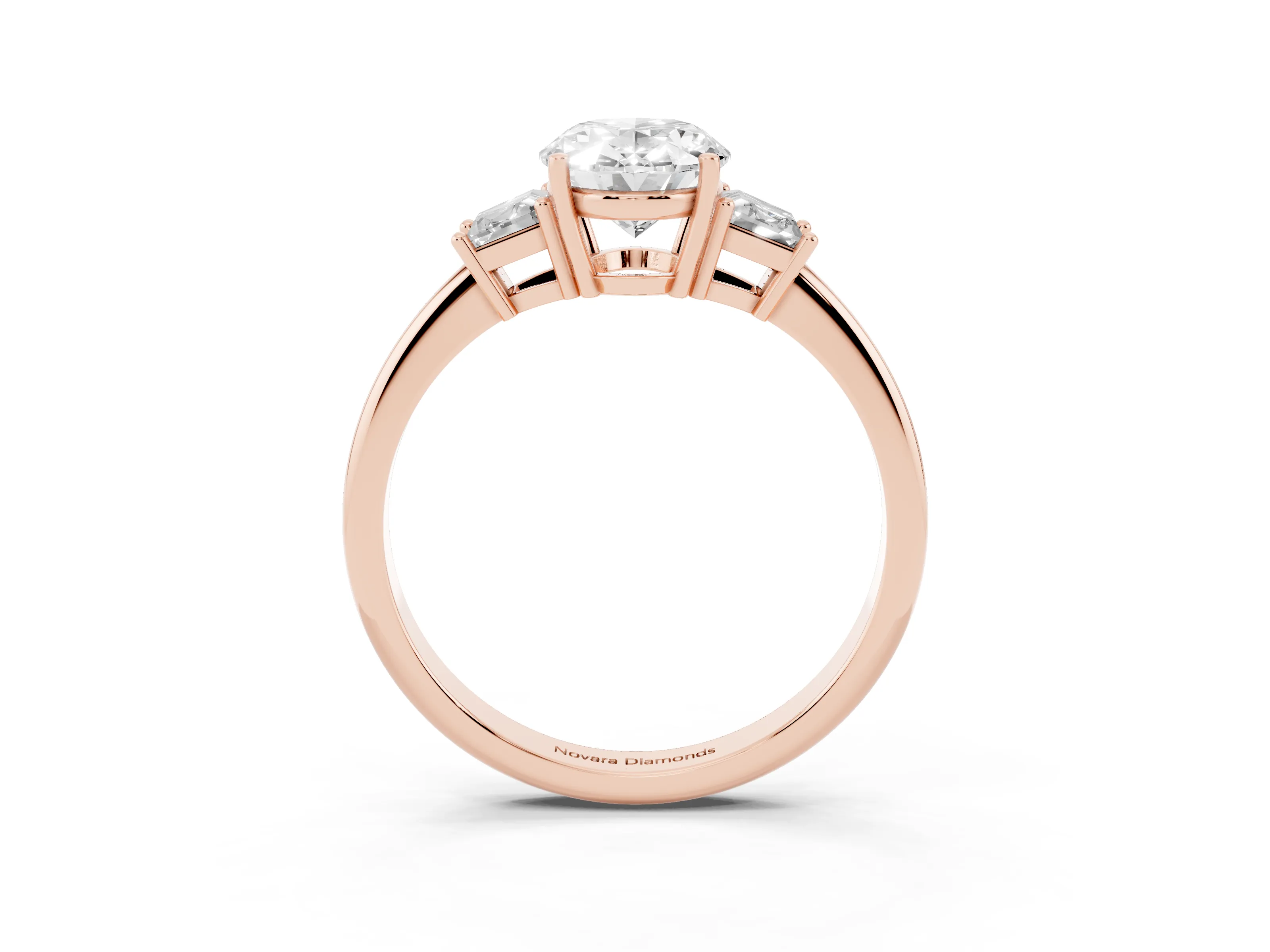 Oval Cut Diamond Three-Stone Ring Set in Rose gold with Trapezoid Side Stones and Prong Setting