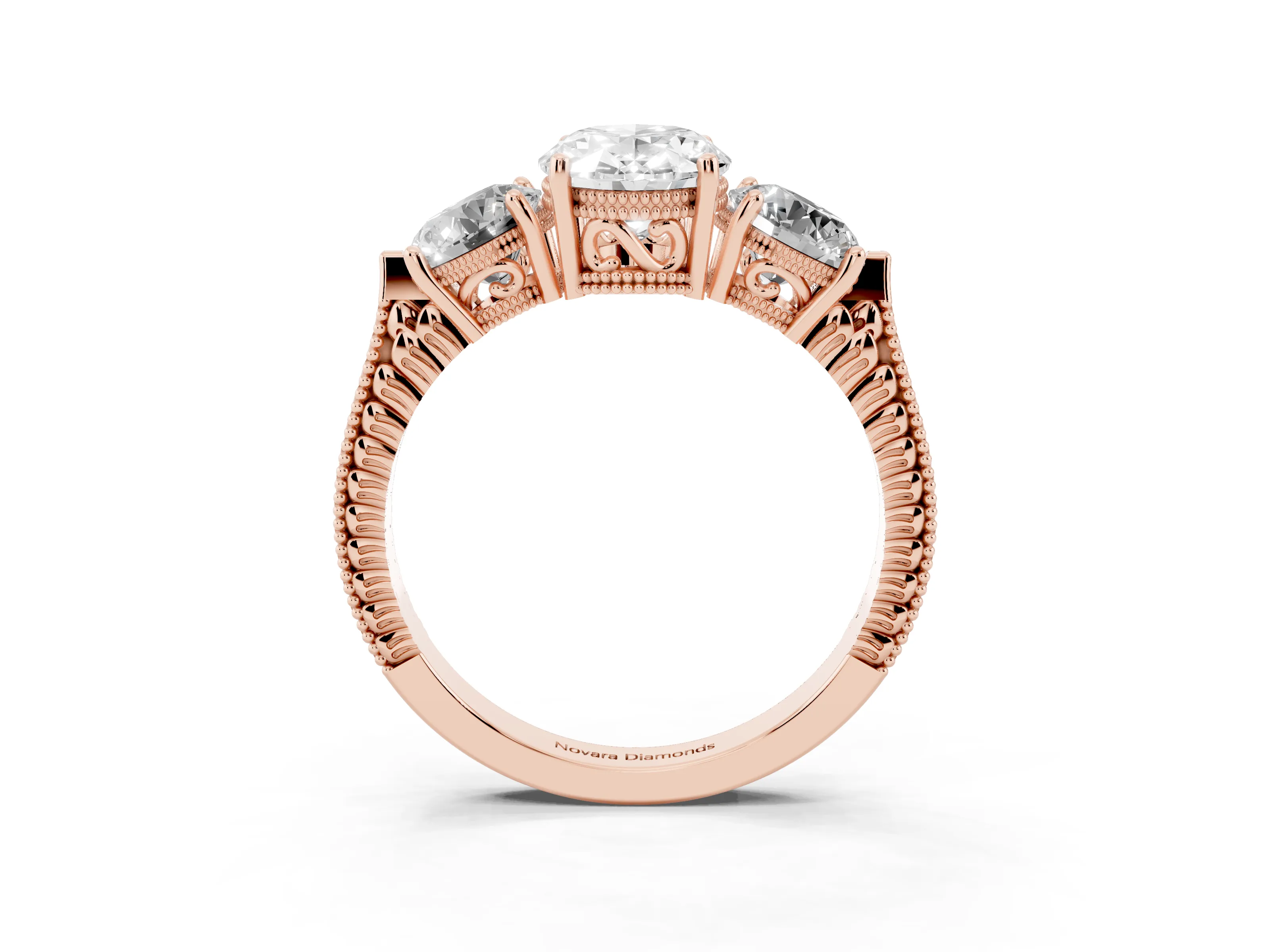 Oval Cut Diamond Three-Stone Ring Set in Rose gold with Milgrain Band