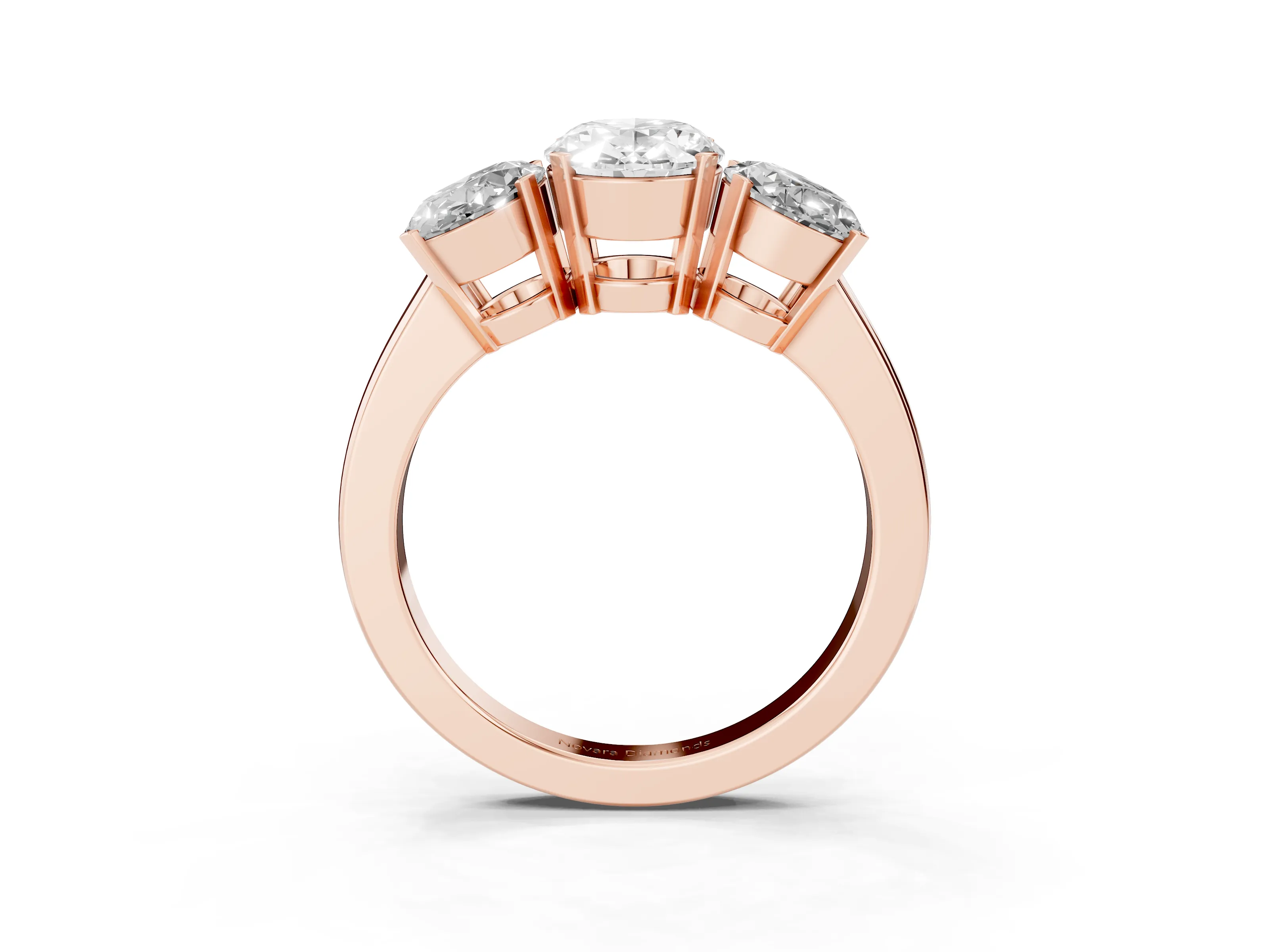 Oval Cut Diamond Three-Stone Ring Set in Rose gold with Channel-Set Band and Prong Settings