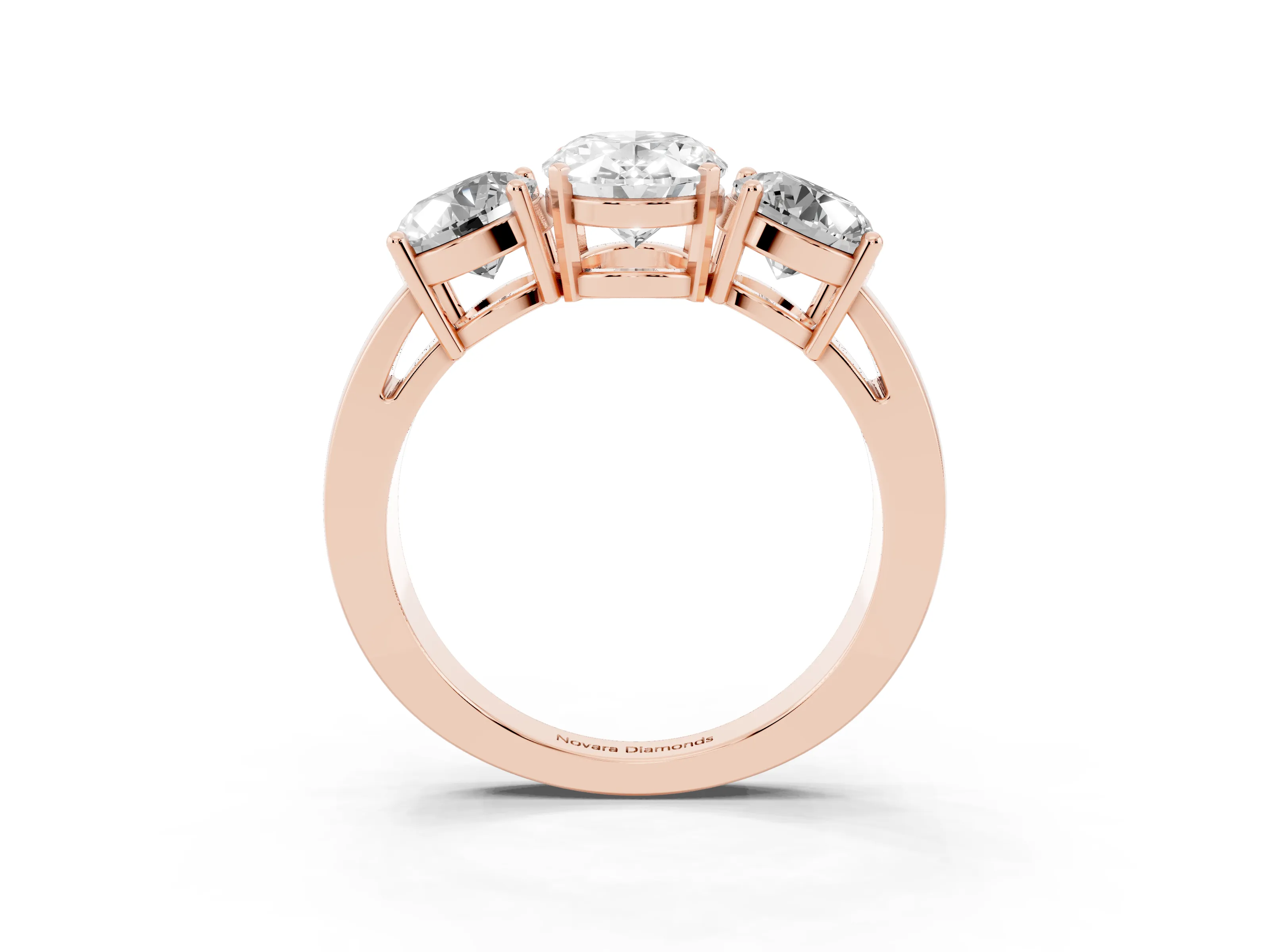 Oval Cut Diamond Three-Stone Ring Set in Rose gold with Round Side Stones and Classic Band