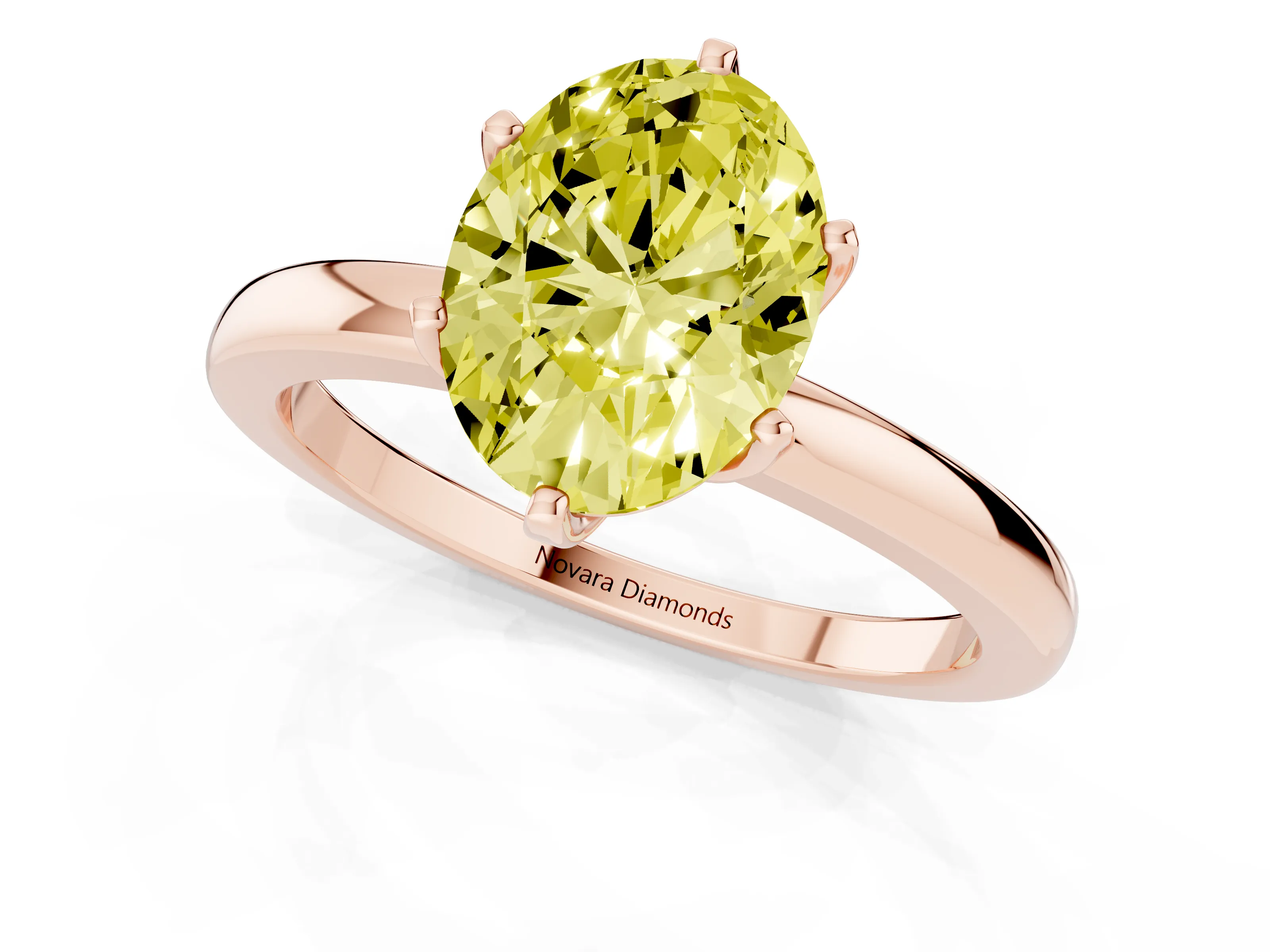 Fancy Yellow Oval Cut Diamond Solitaire Ring Set in Rose gold with Raised Prong Setting on a Classic Band