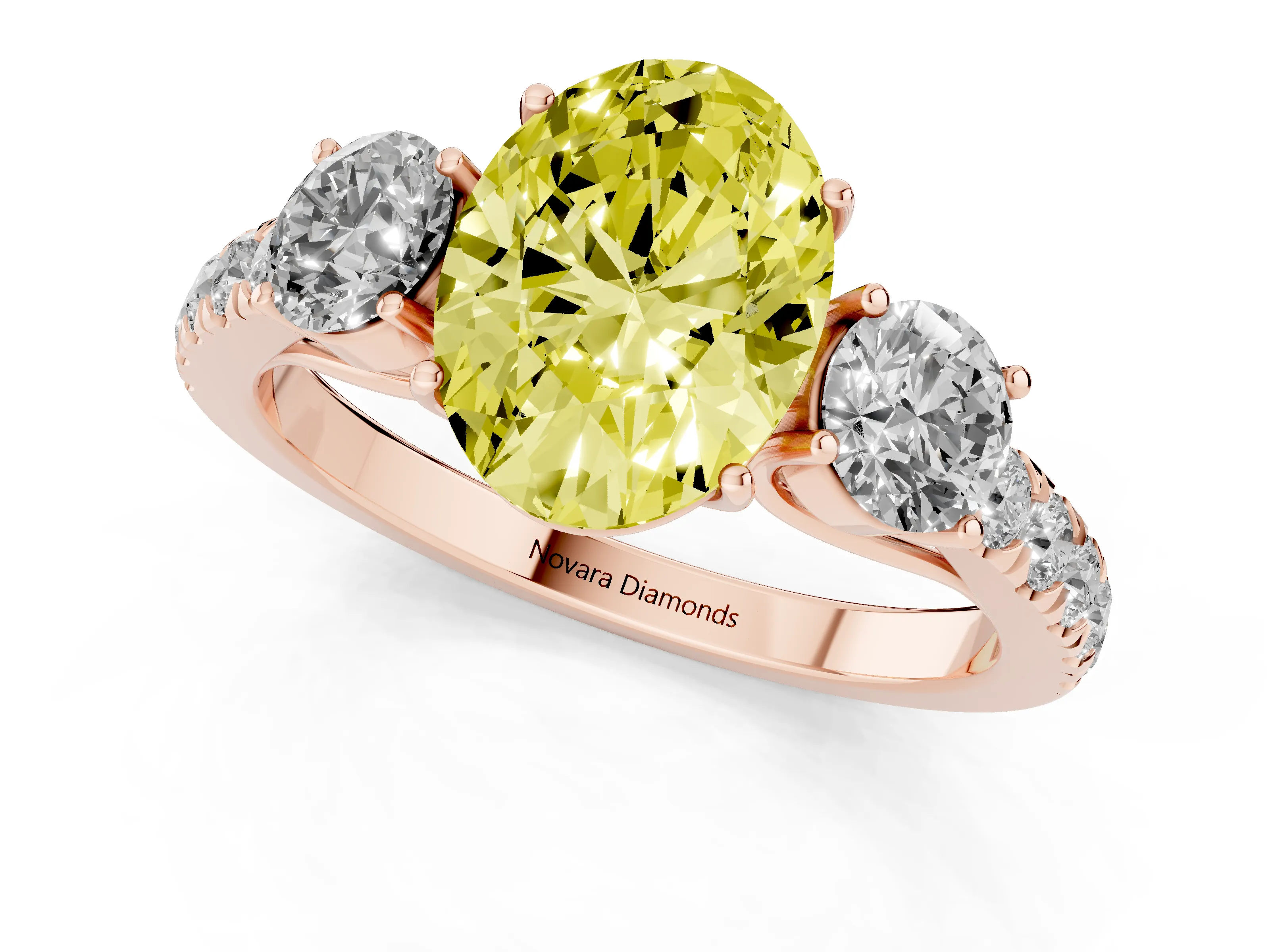 Fancy Yellow Oval Cut Diamond Three-Stone Ring Set in Rose gold with Round Side Stones and Delicate Pavé Band