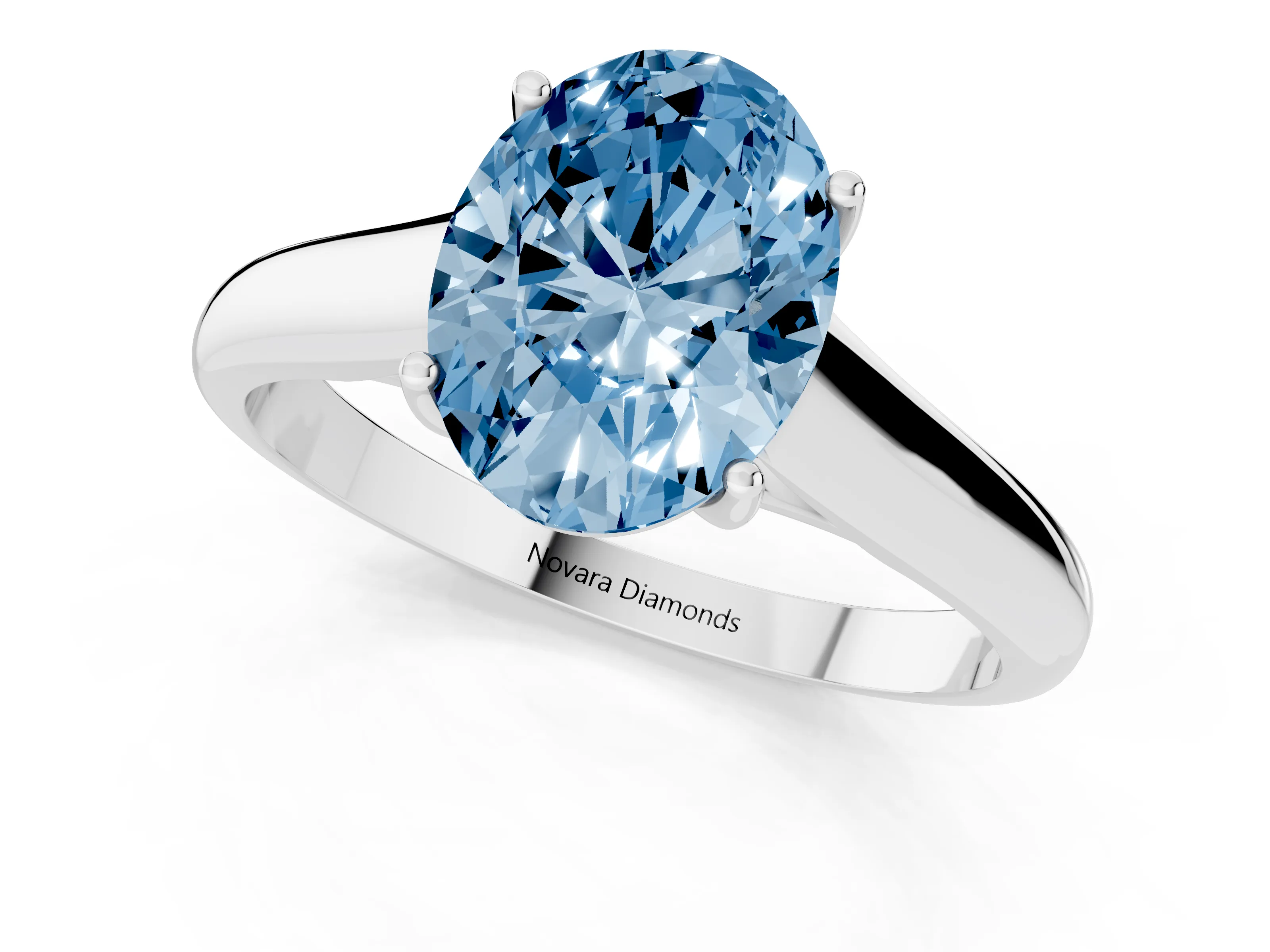 Fancy Blue Oval Cut Diamond Solitaire Engagement Ring Set in Silver with Subtly Tapered Band and Prong Setting