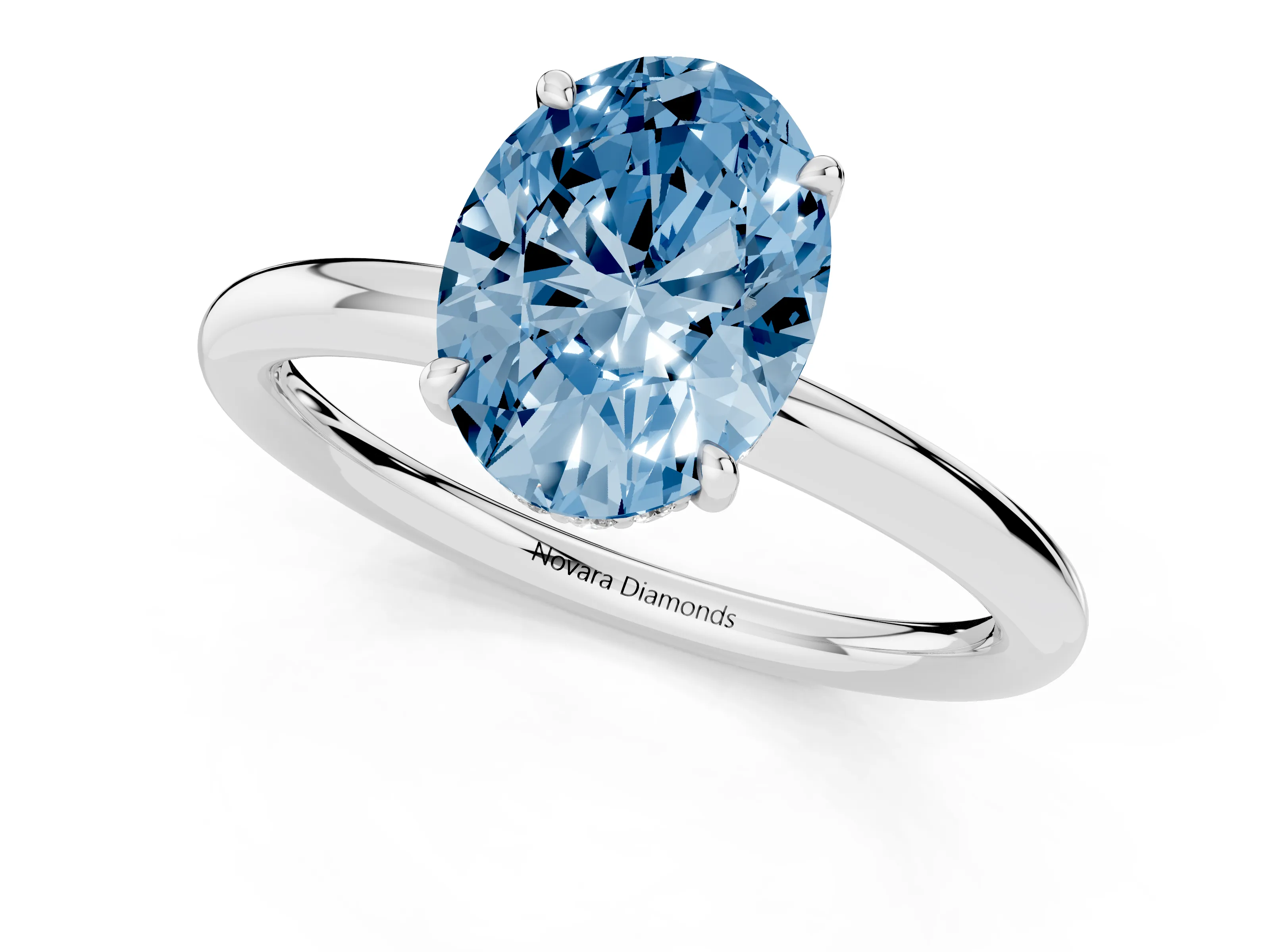 Fancy Blue Oval Cut Diamond Solitaire Ring Set in White gold with Thin Band and Prong Setting