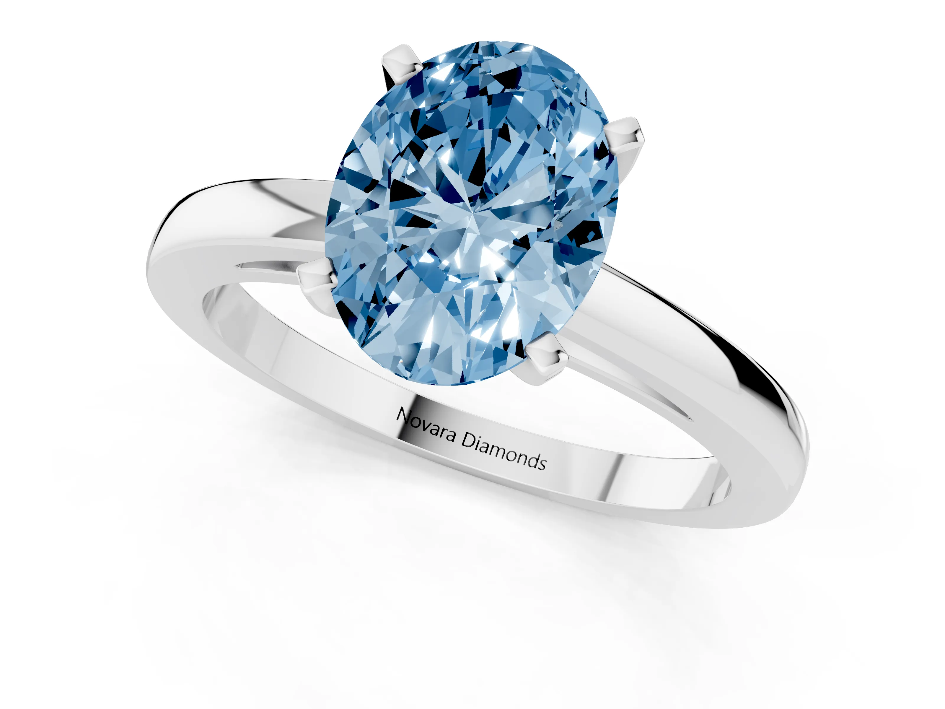 Fancy Blue Oval Cut Diamond Solitaire Engagement Ring Set in Silver with Prong Setting on a Classic Band