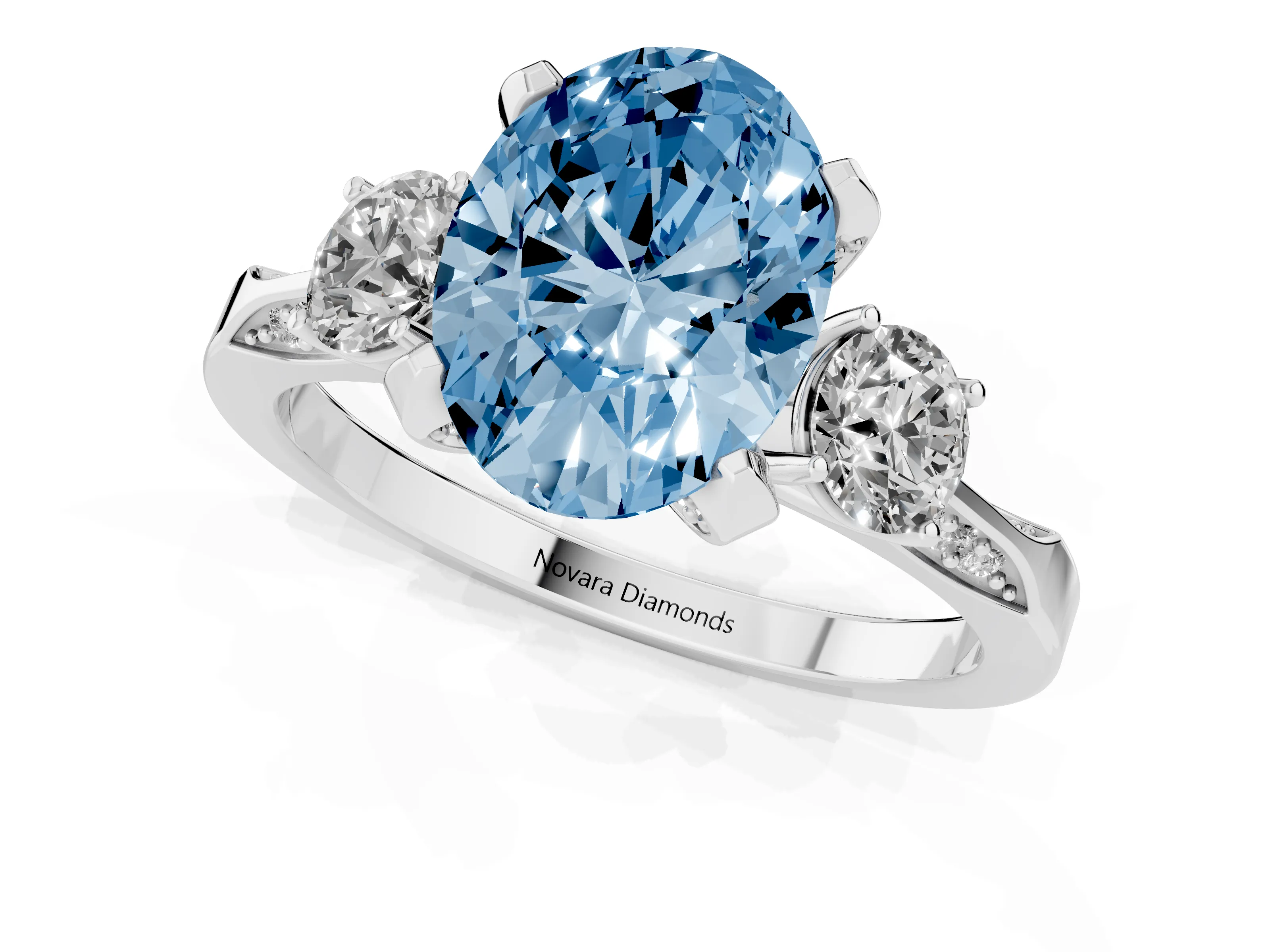 Fancy Blue Oval Cut Diamond Three-Stone Ring Set in White gold with Pavé Band and Smaller Side Stones