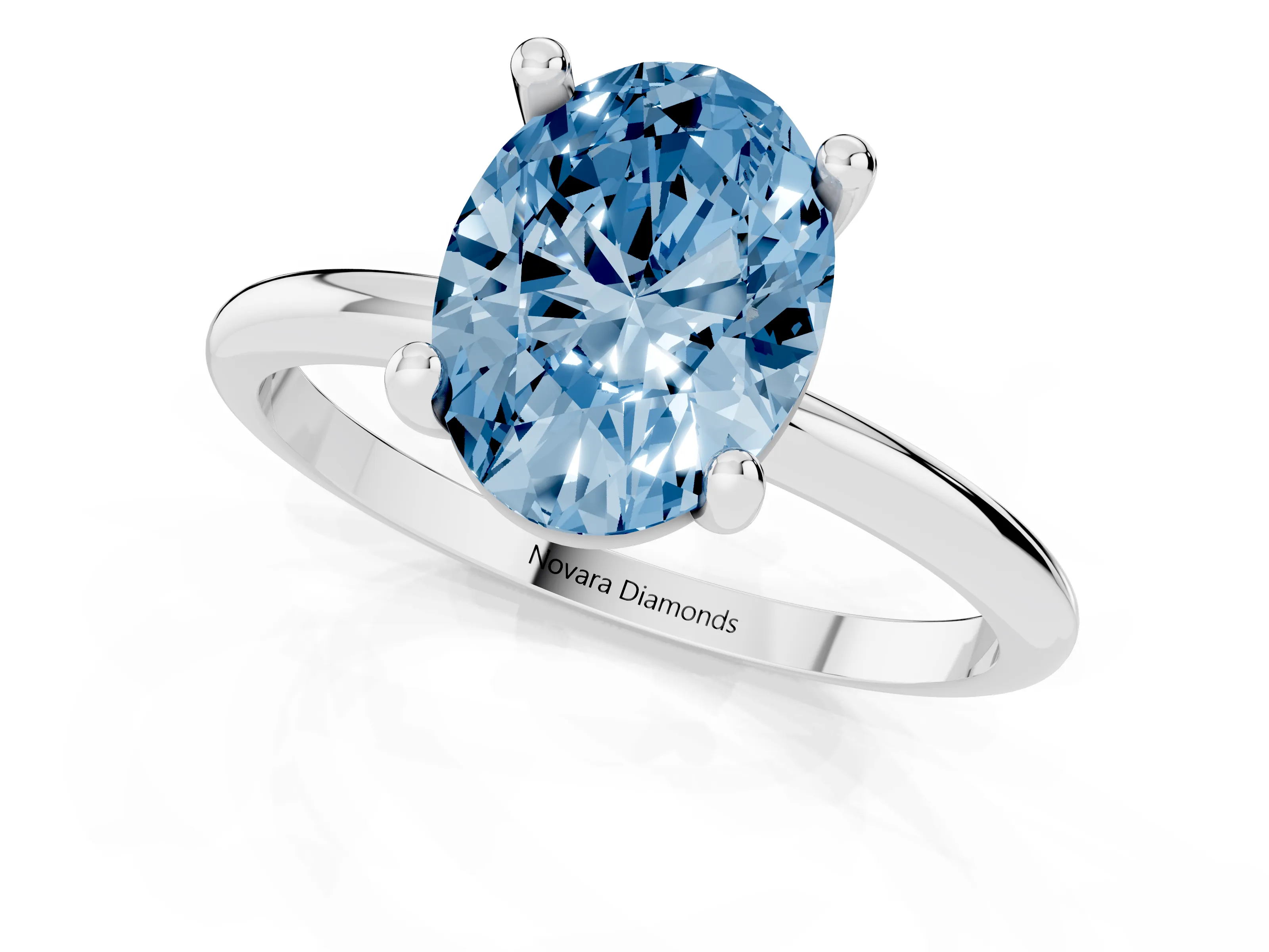 Fancy Blue Oval Cut Diamond Solitaire Ring Set in Silver with Secure Prong Setting on a Classic Band
