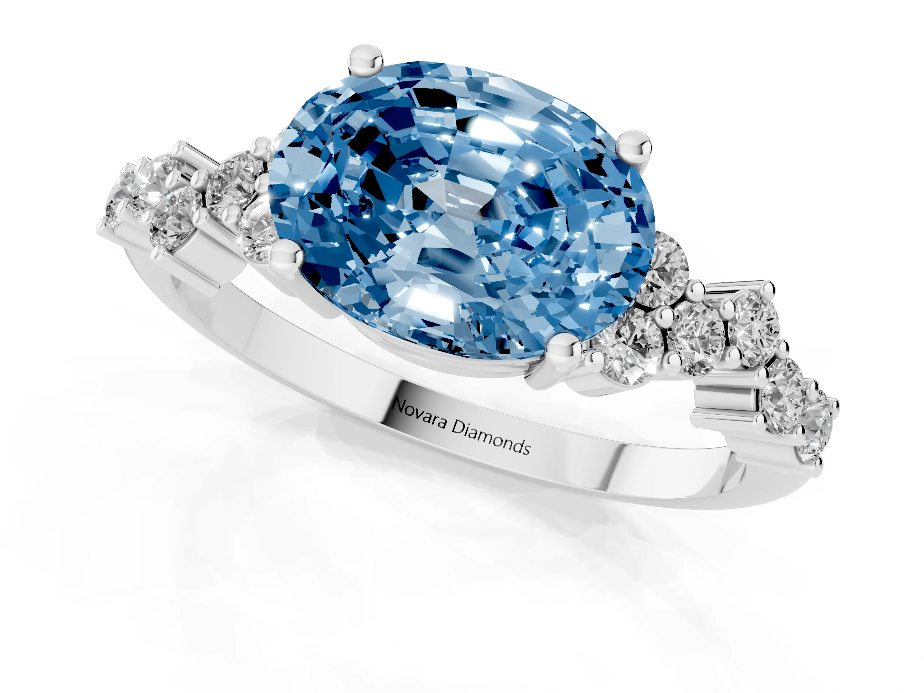 Fancy Blue Oval Cut Diamond Ring Set in Platinum with Scattered Round Accents