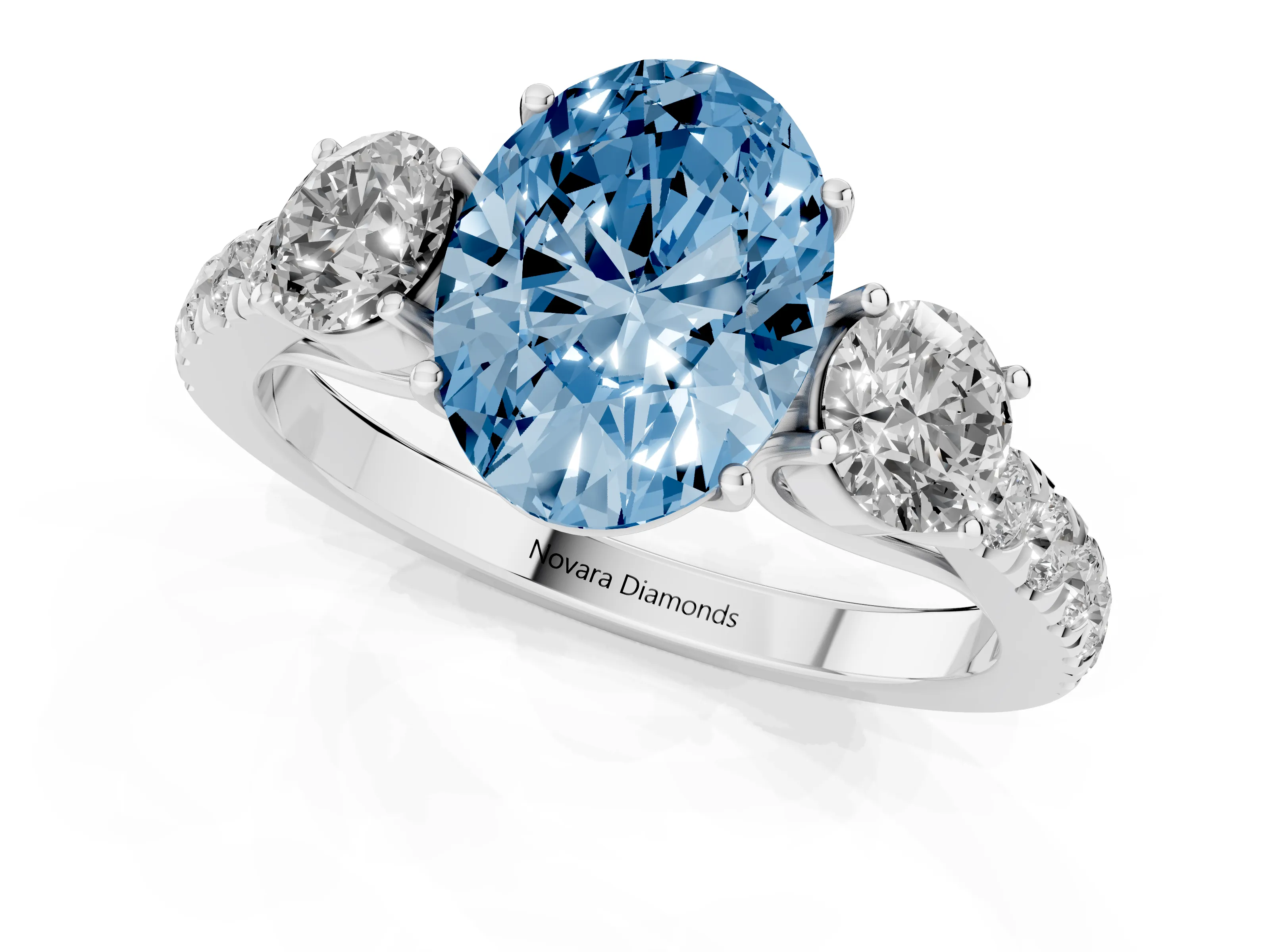 Fancy Blue Oval Cut Diamond Three-Stone Ring Set in White gold with Round Side Stones and Delicate Pavé Band