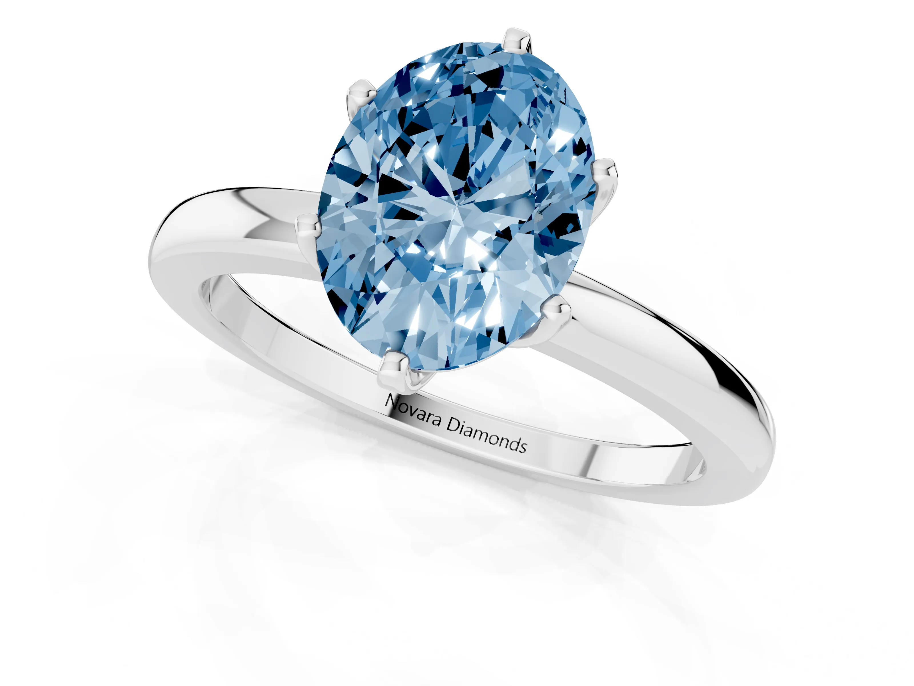 Fancy Blue Oval Cut Diamond Solitaire Ring Set in White gold with Raised Prong Setting on a Classic Band
