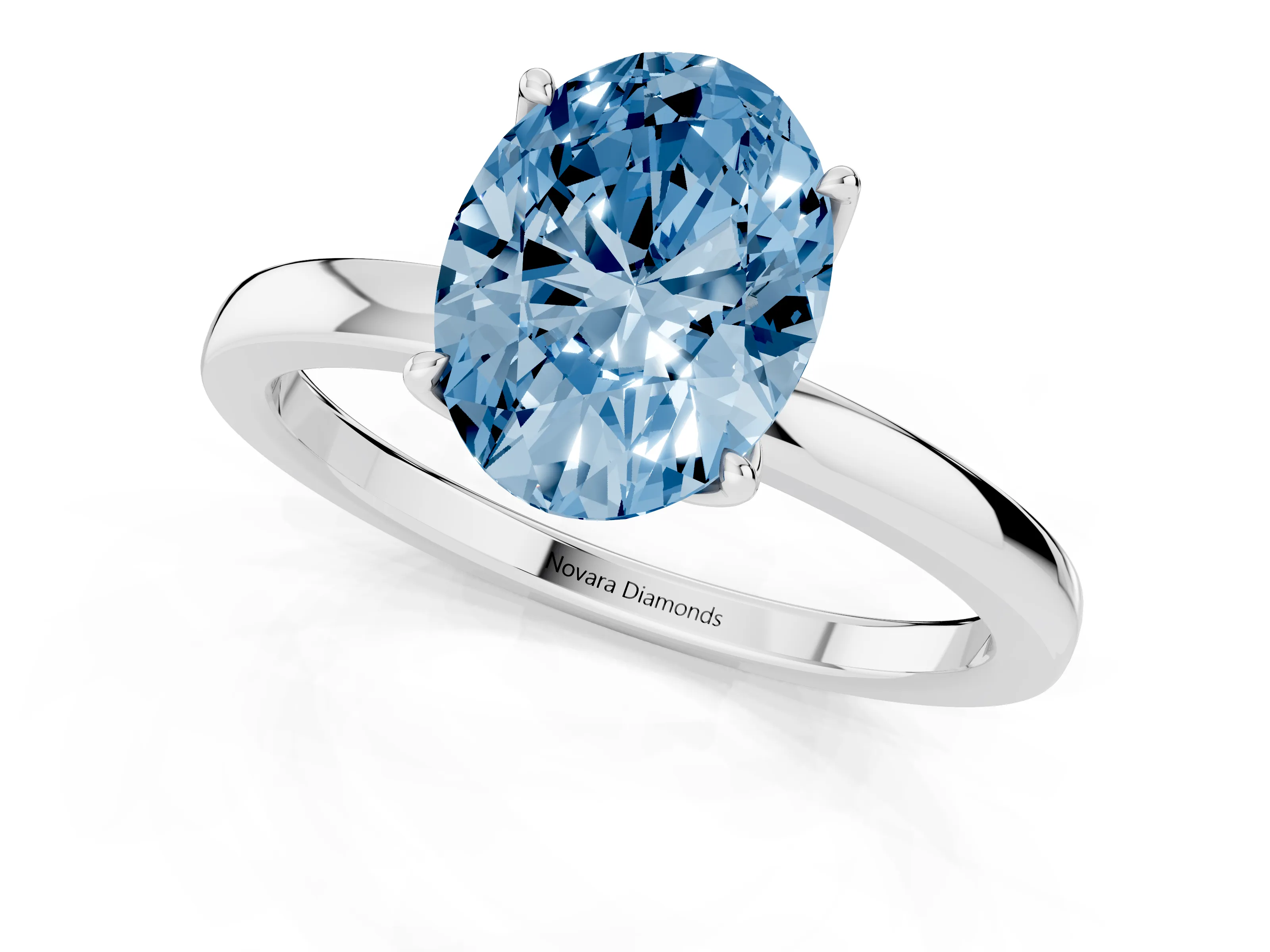 Fancy Blue Oval Cut Diamond Solitaire Ring Set in White gold with Prong Setting and Thin Polished Band