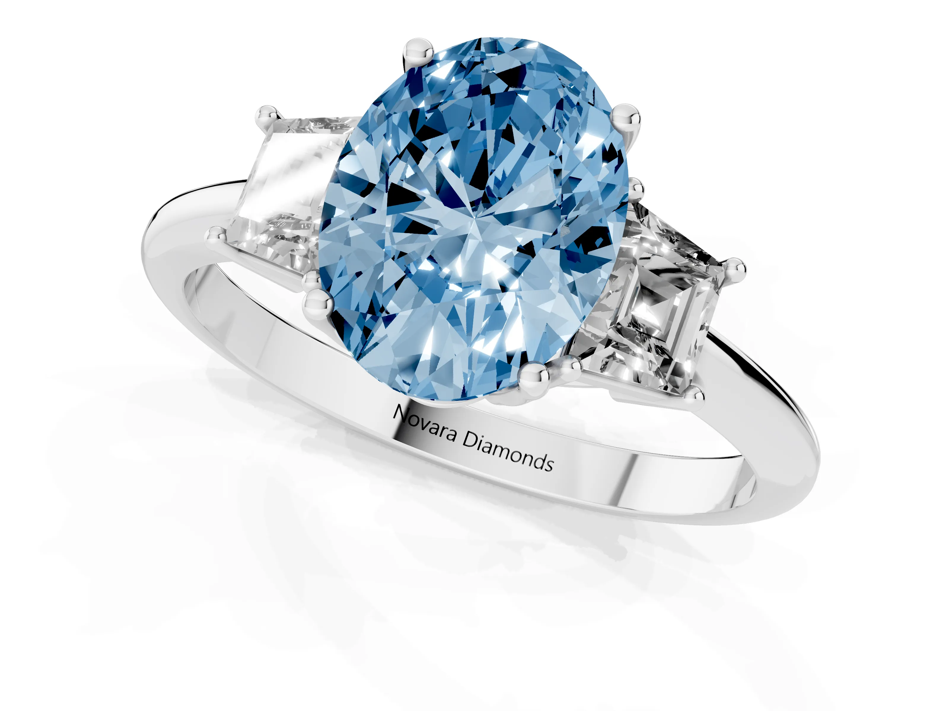Fancy Blue Oval Cut Diamond Three-Stone Ring Set in White gold with Trapezoid Side Stones and Prong Setting