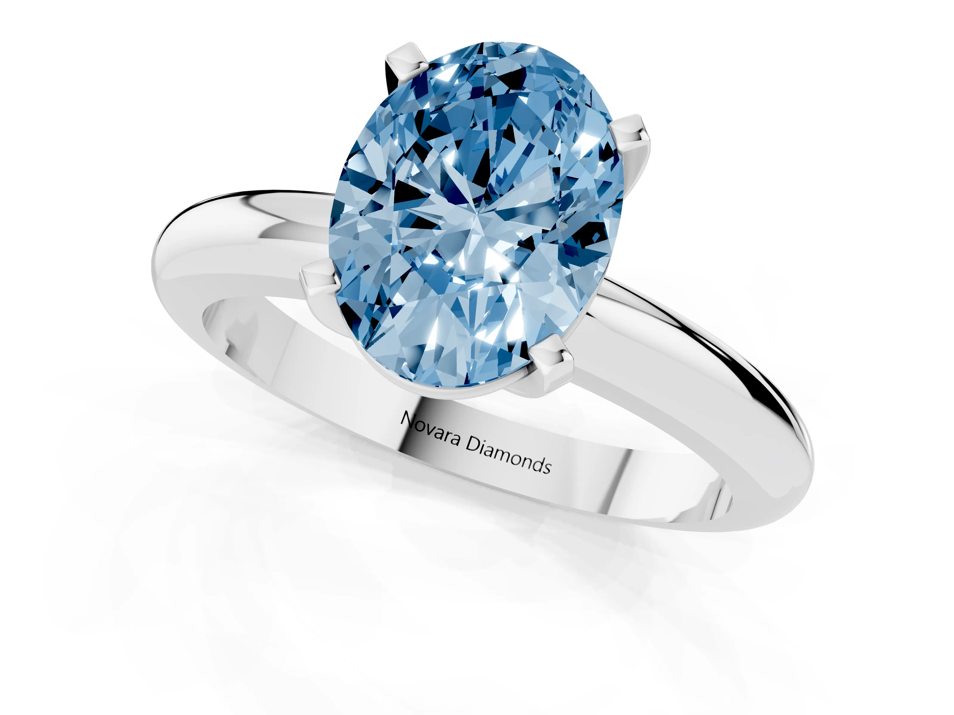 Fancy Blue Oval Cut Diamond Solitaire Engagement Ring Set in White gold with Round Band and Prong Setting
