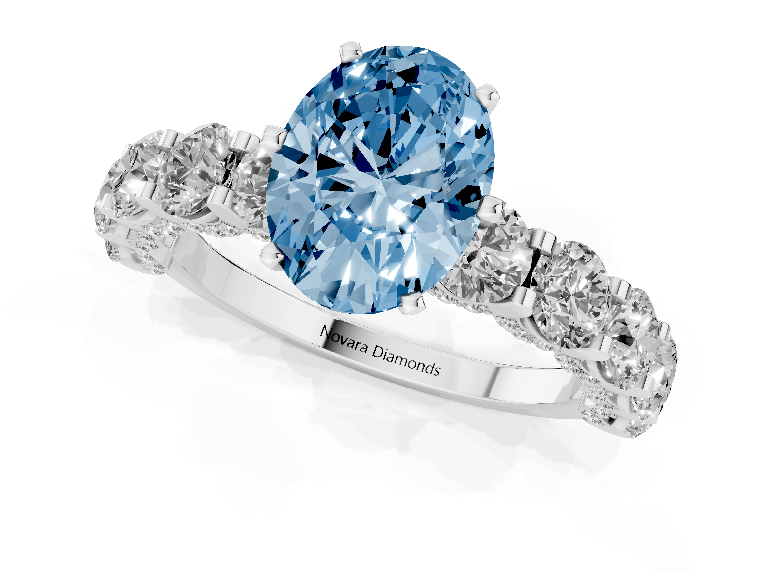 Fancy Blue Oval Cut Diamond Side Stone Ring Set in White gold with Alternating Round and Oval Side Stones