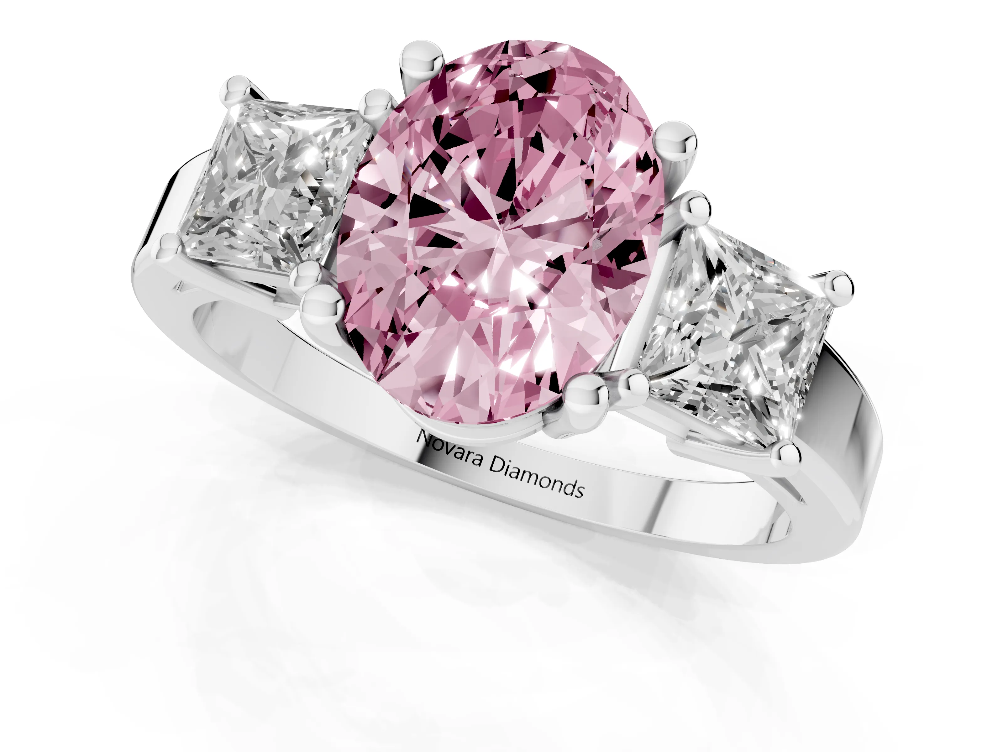 Fancy Pink Three-Stone Oval Cut Diamond Solitaire Ring Set in Platinum with Prong Setting