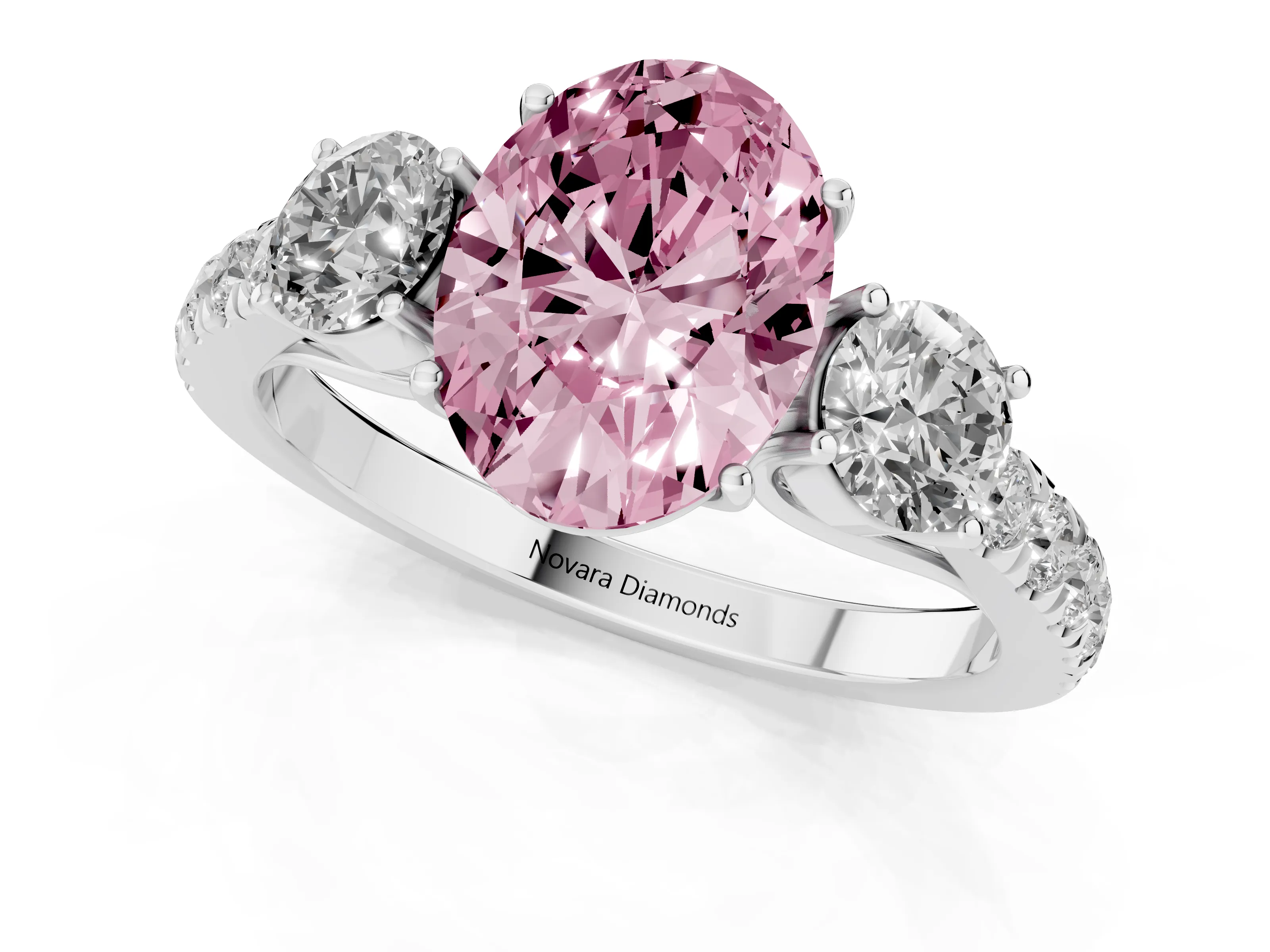 Fancy Pink Oval Cut Diamond Three-Stone Ring Set in Platinum with Round Side Stones and Delicate Pavé Band