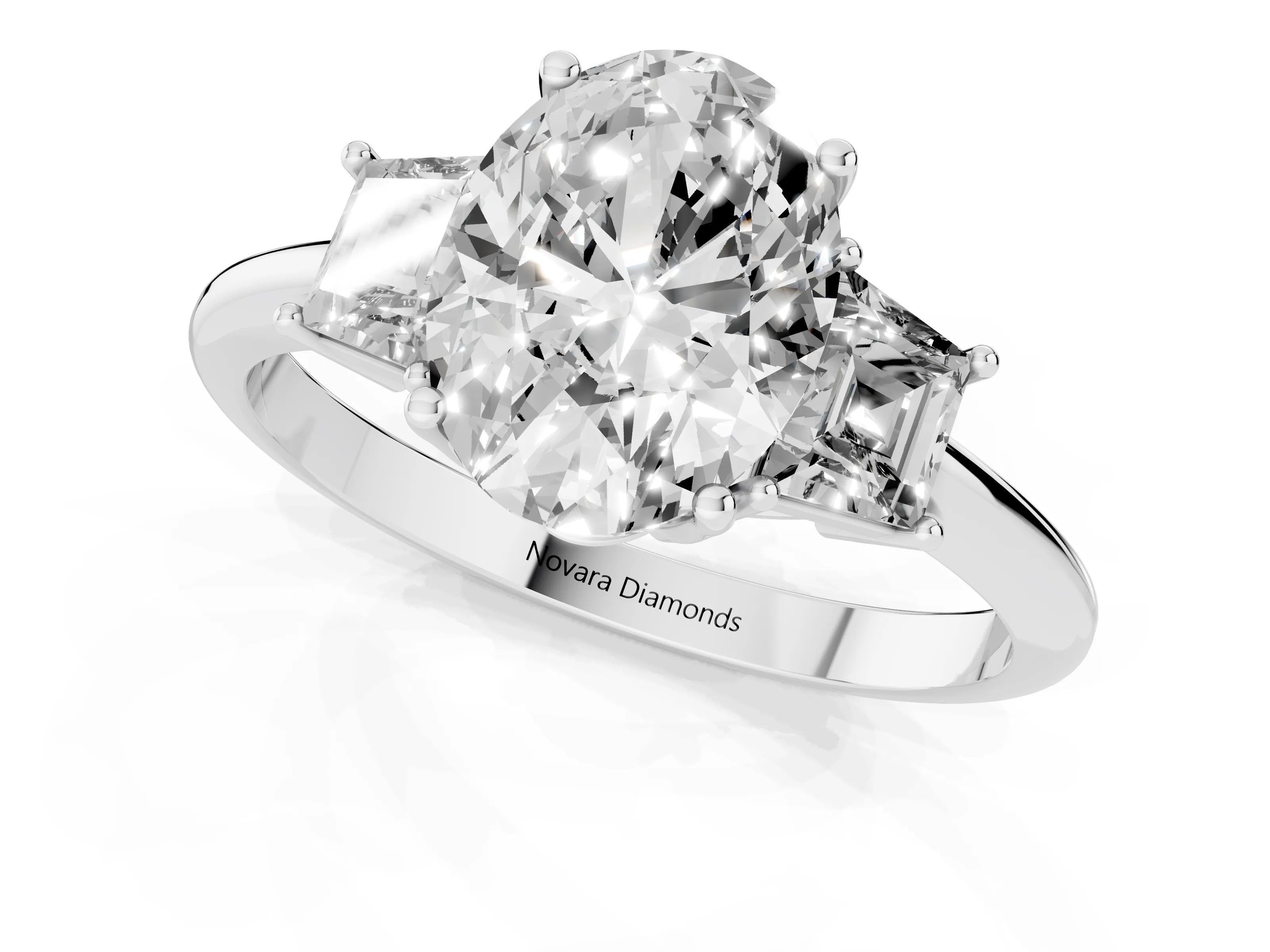 Oval Cut Diamond Three-Stone Ring Set in White gold with Trapezoid Side Stones and Prong Setting