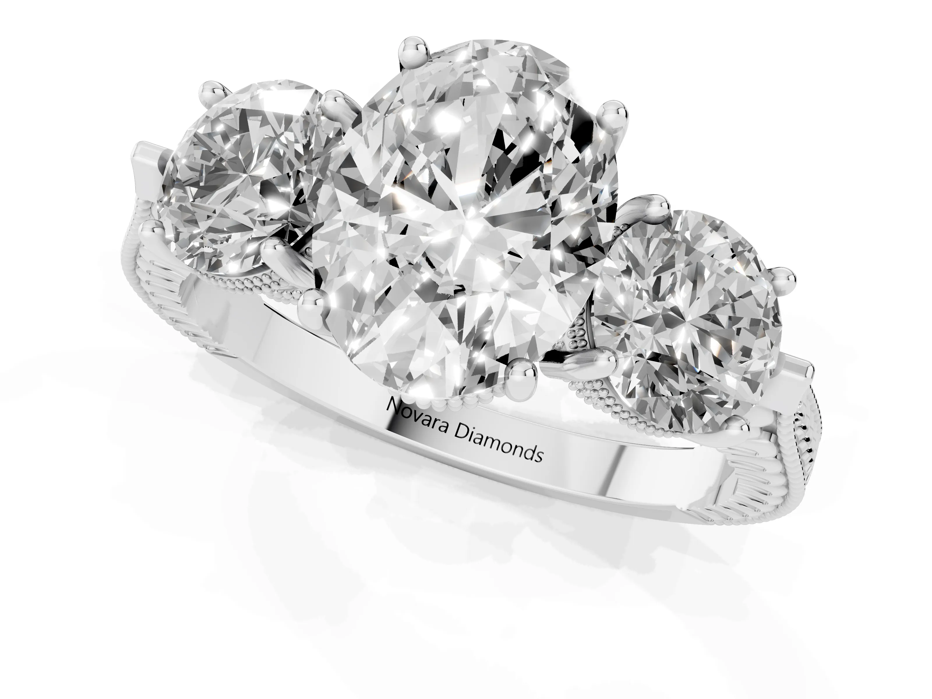 Oval Cut Diamond Three-Stone Ring Set in Platinum with Milgrain Band