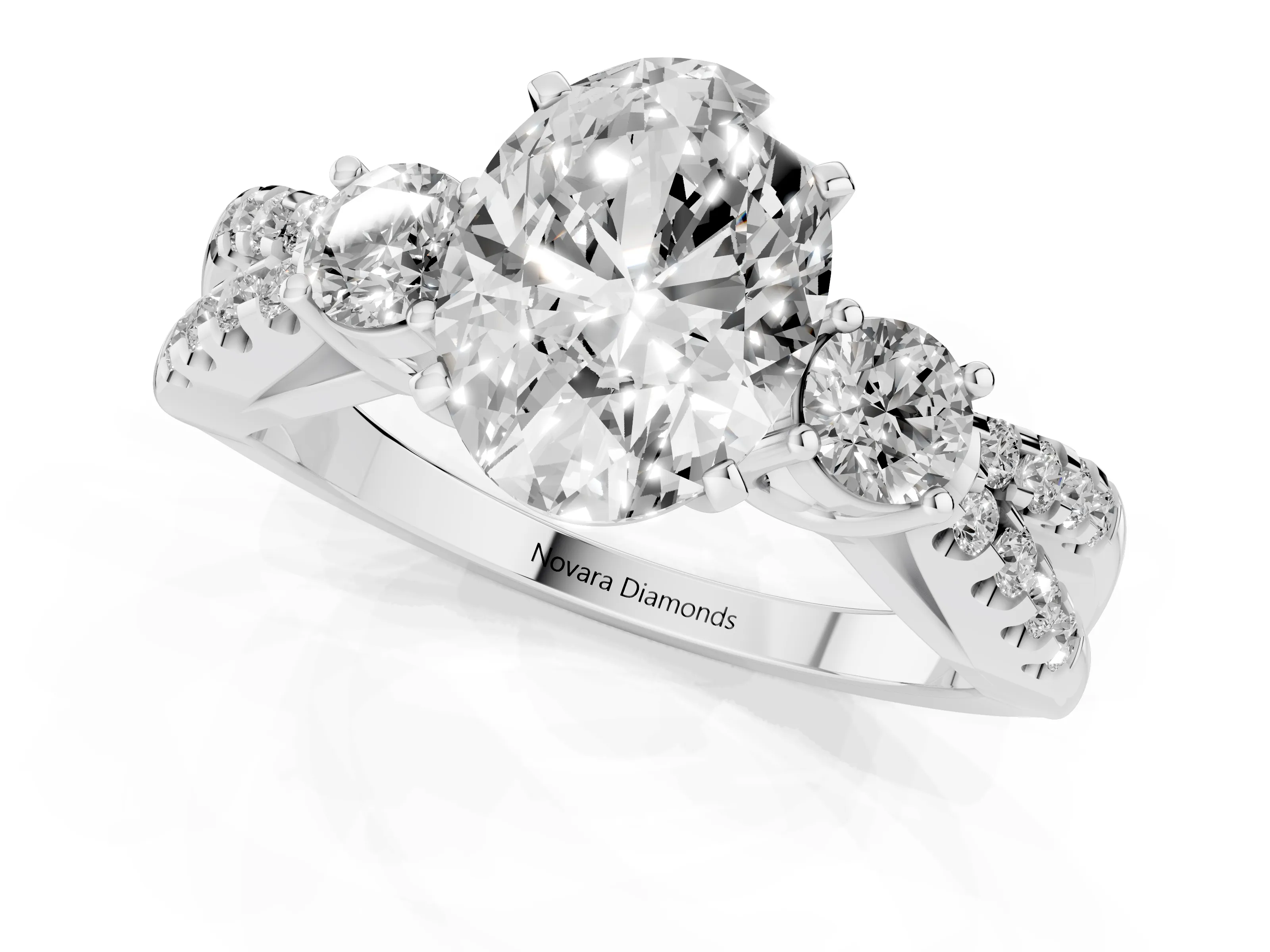 Oval Cut Diamond Three-Stone Ring Set in Platinum with Pavé Split Shank and Prong Setting