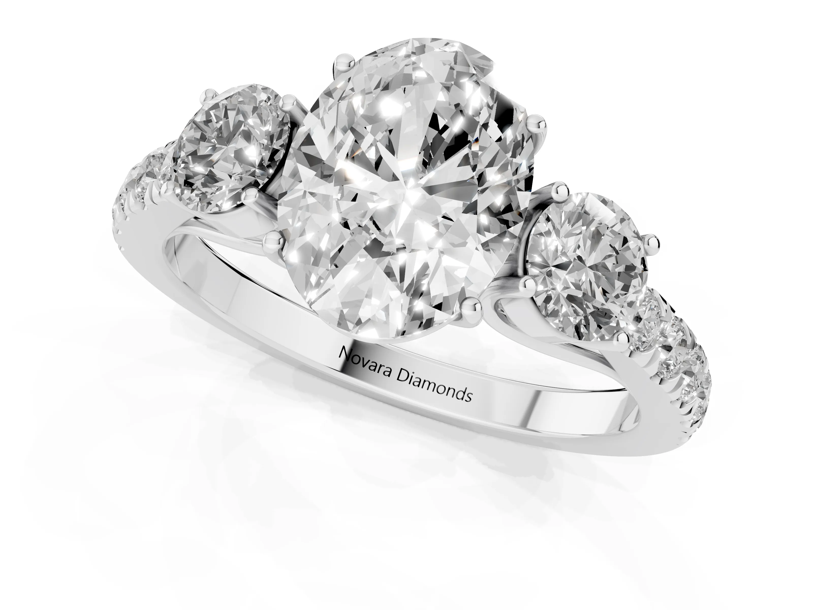 Oval Cut Diamond Three-Stone Ring Set in White gold with Round Side Stones and Delicate Pavé Band