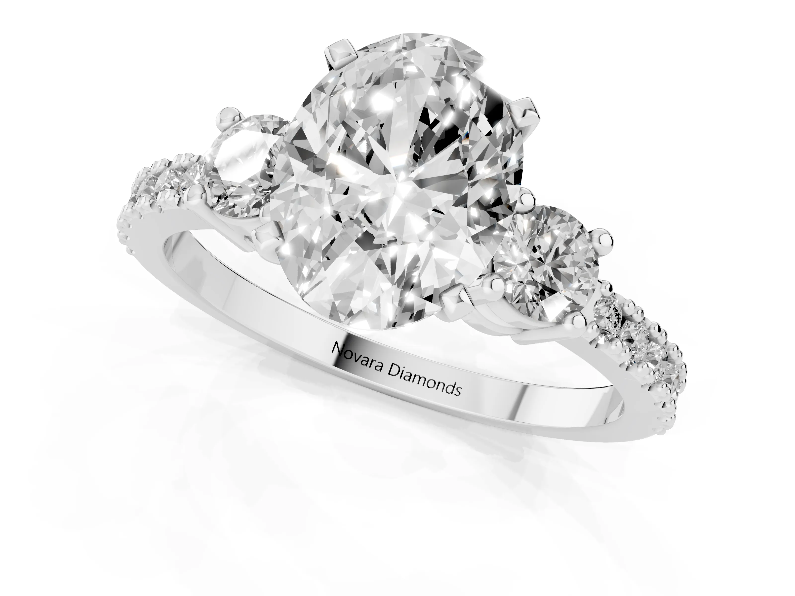 Three-Stone Oval Cut Diamond Pavé Band Ring Set in Platinum with Prong Setting