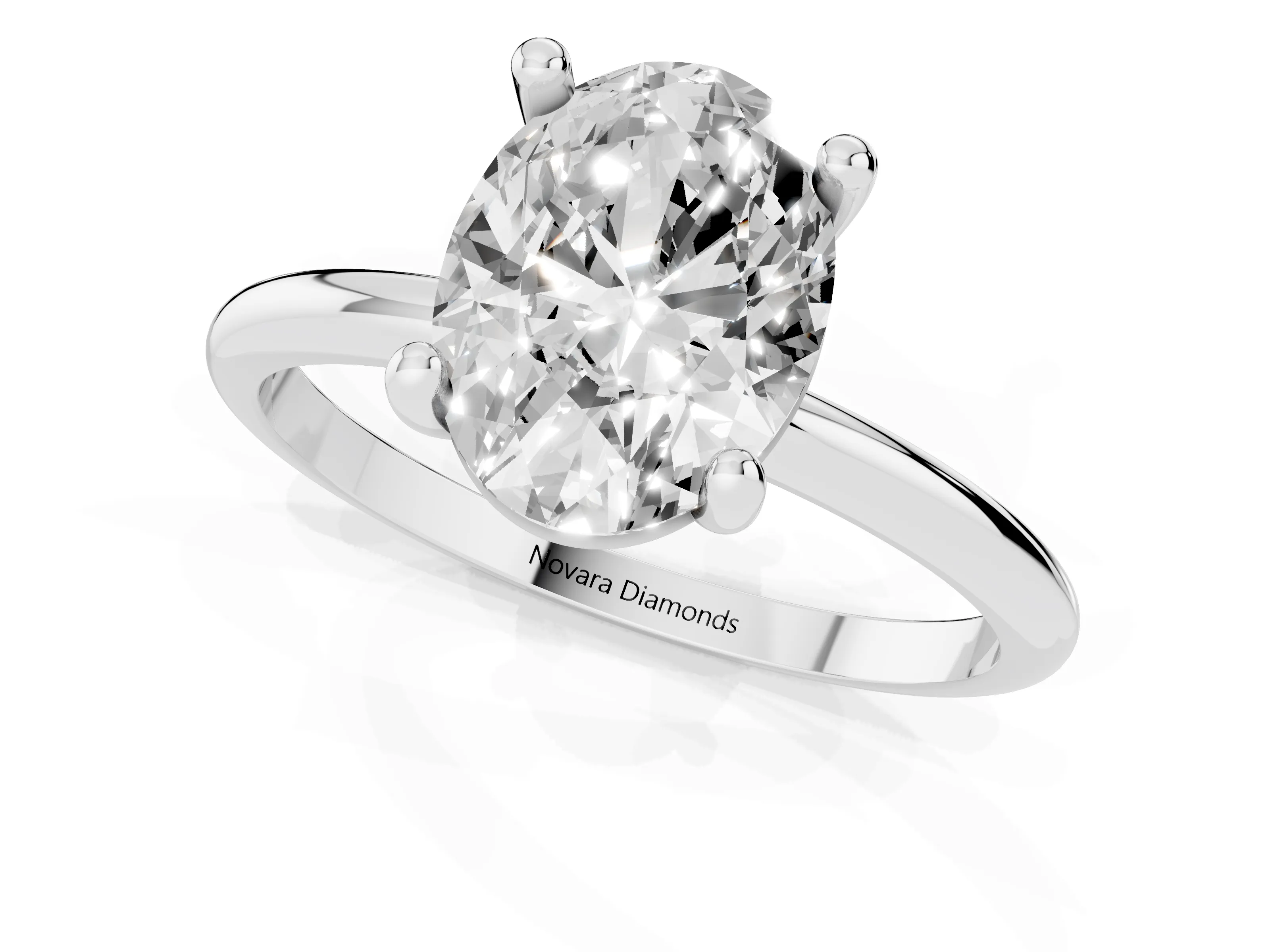 Oval Cut Diamond Solitaire Ring Set in White gold with Secure Prong Setting on a Classic Band
