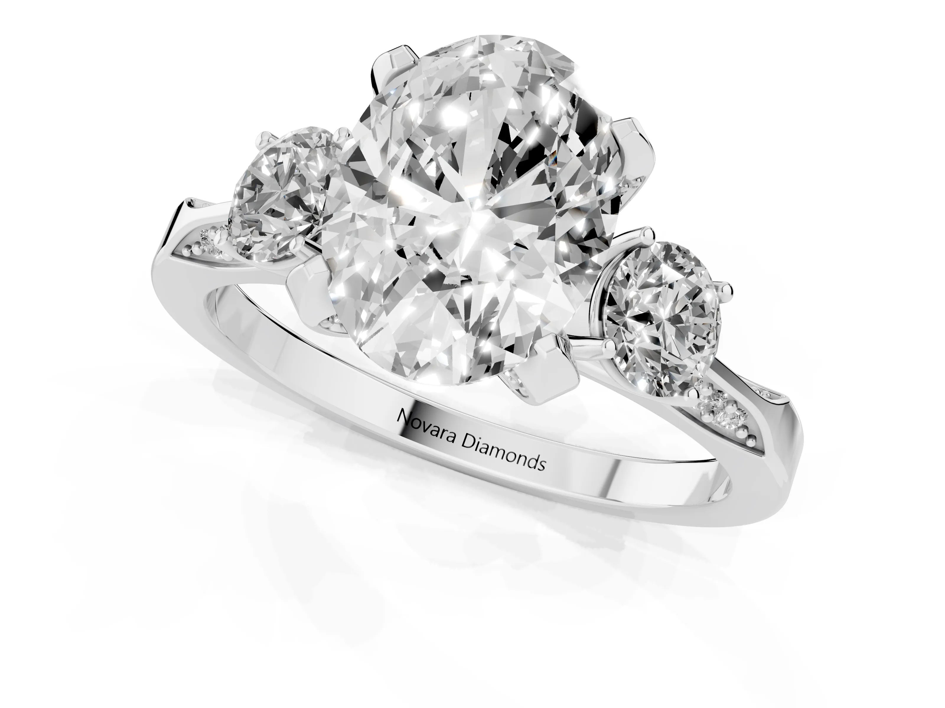 Oval Cut Diamond Three-Stone Ring Set in White gold with Pavé Band and Smaller Side Stones