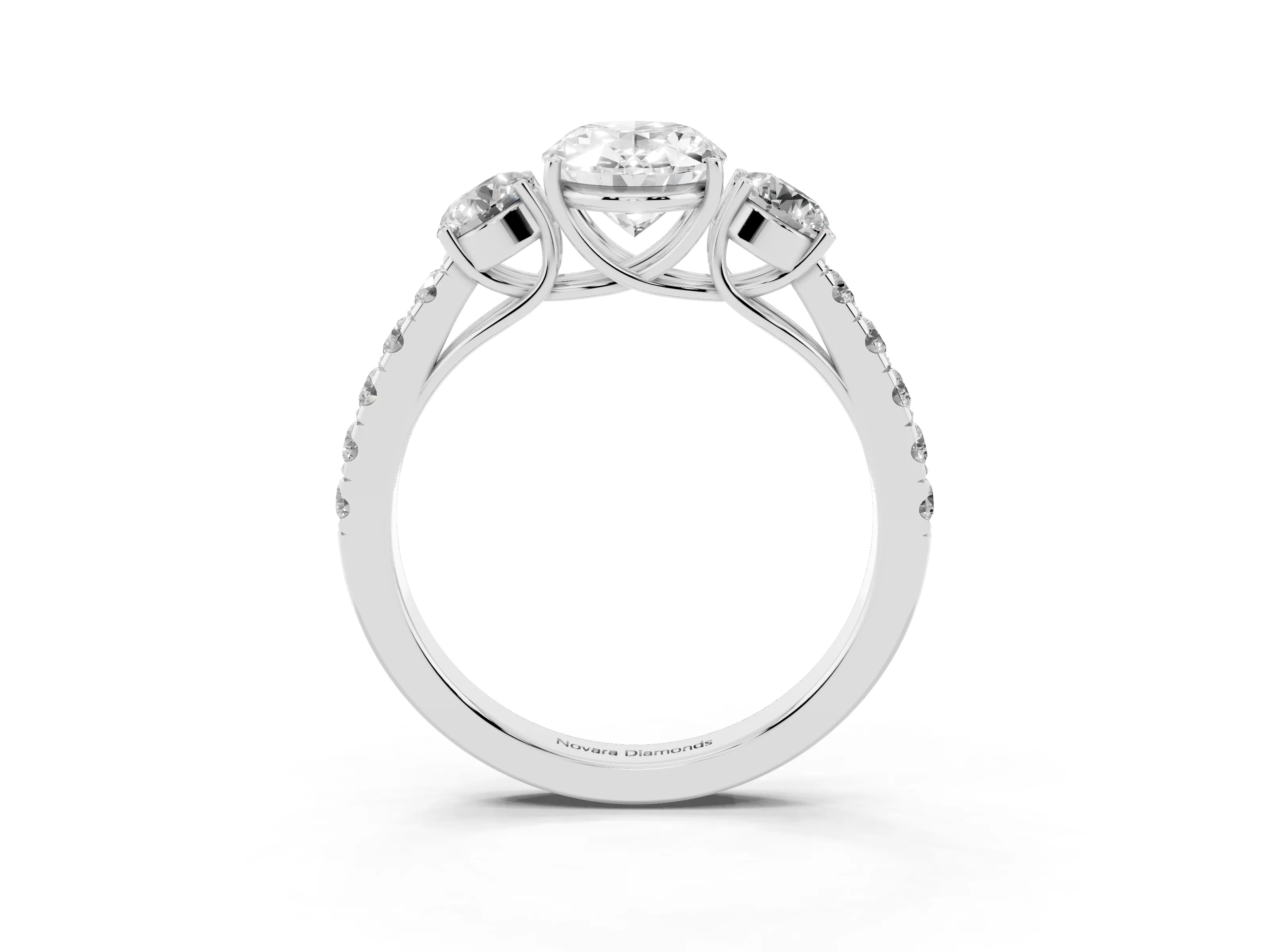 Oval Cut Diamond Three-Stone Ring Set in White gold with Round Side Stones and Delicate Pavé Band
