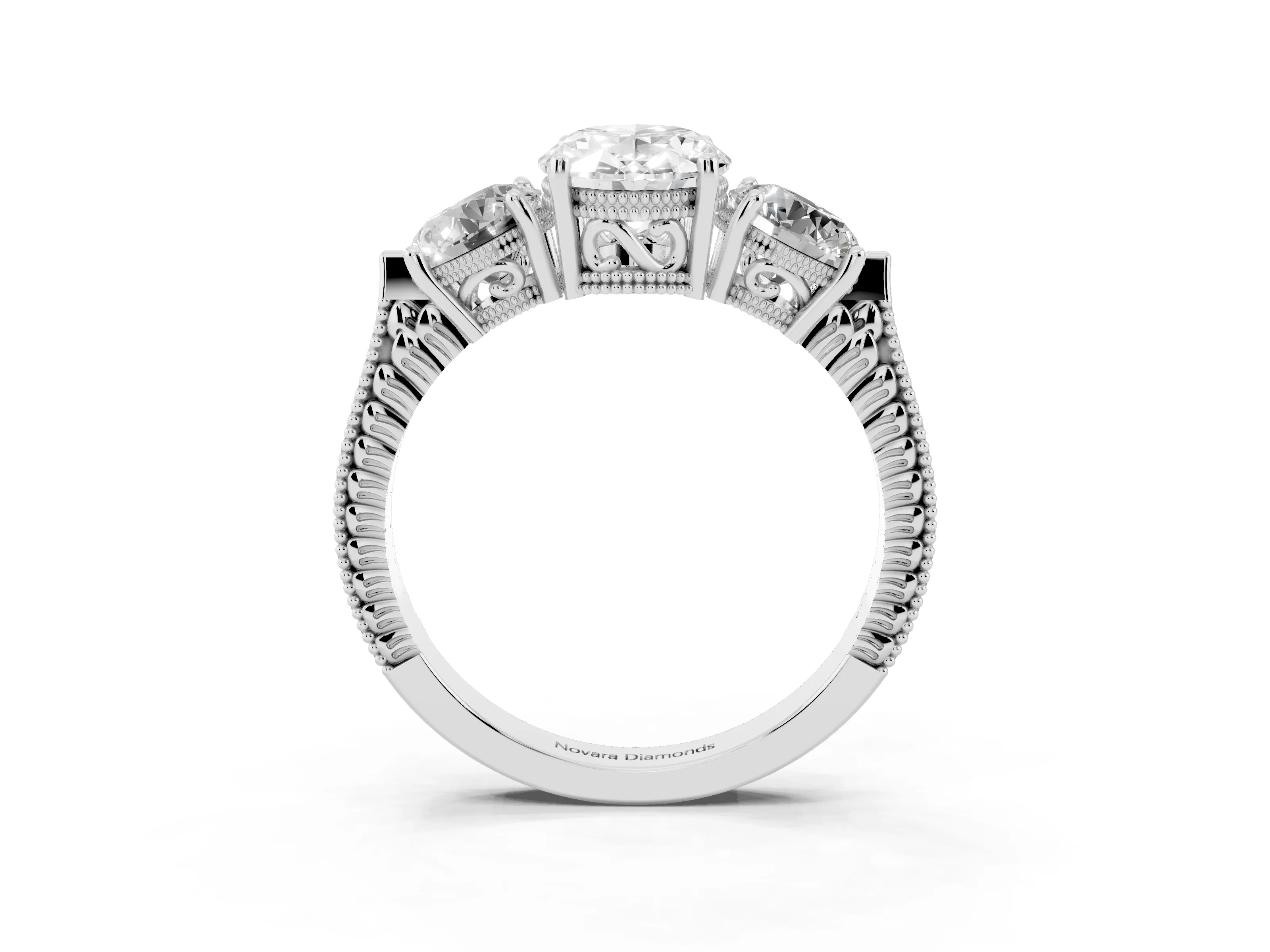 Oval Cut Diamond Three-Stone Ring Set in Platinum with Milgrain Band