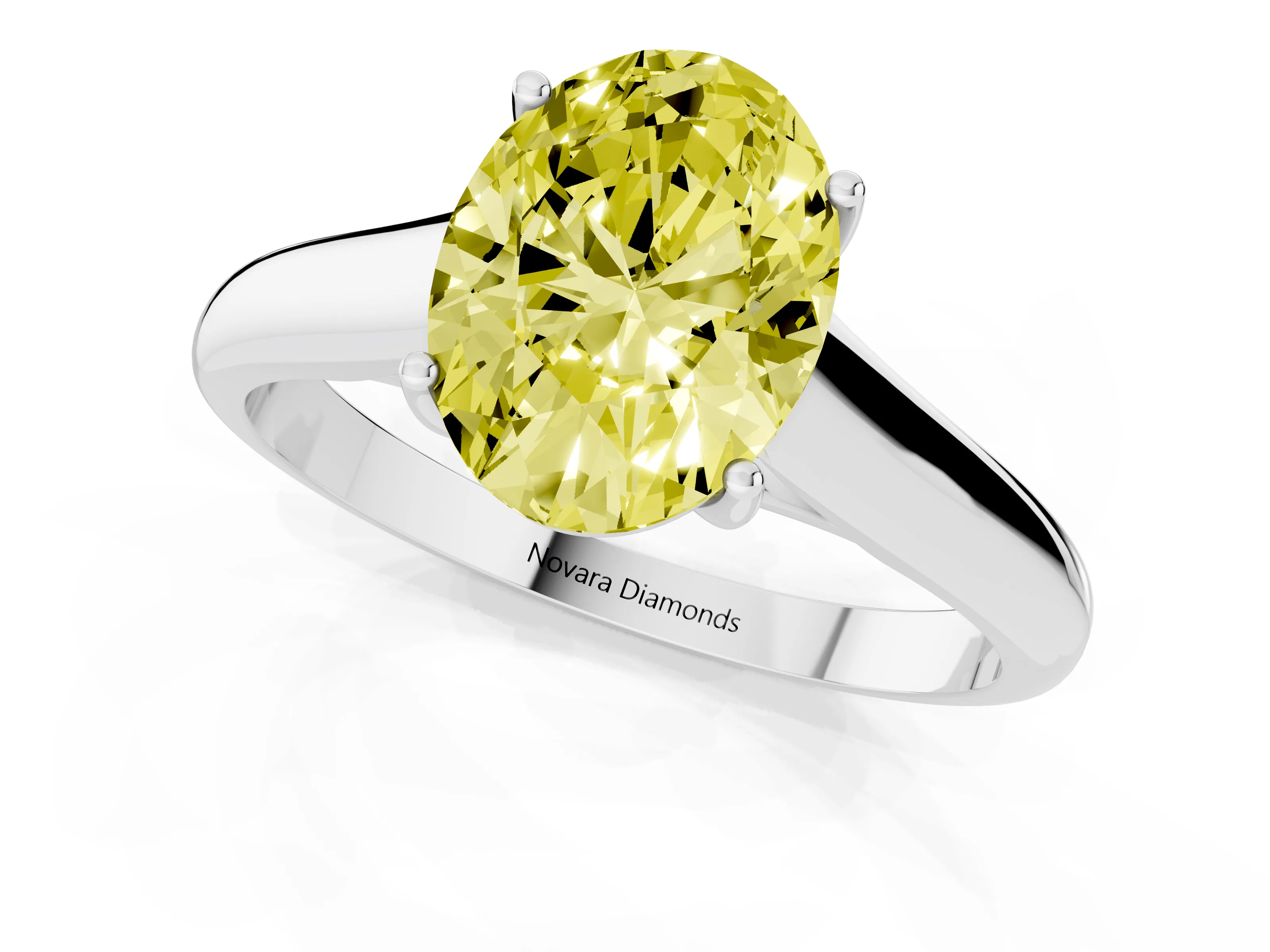 Fancy Yellow Oval Cut Diamond Solitaire Engagement Ring Set in White gold with Subtly Tapered Band and Prong Setting