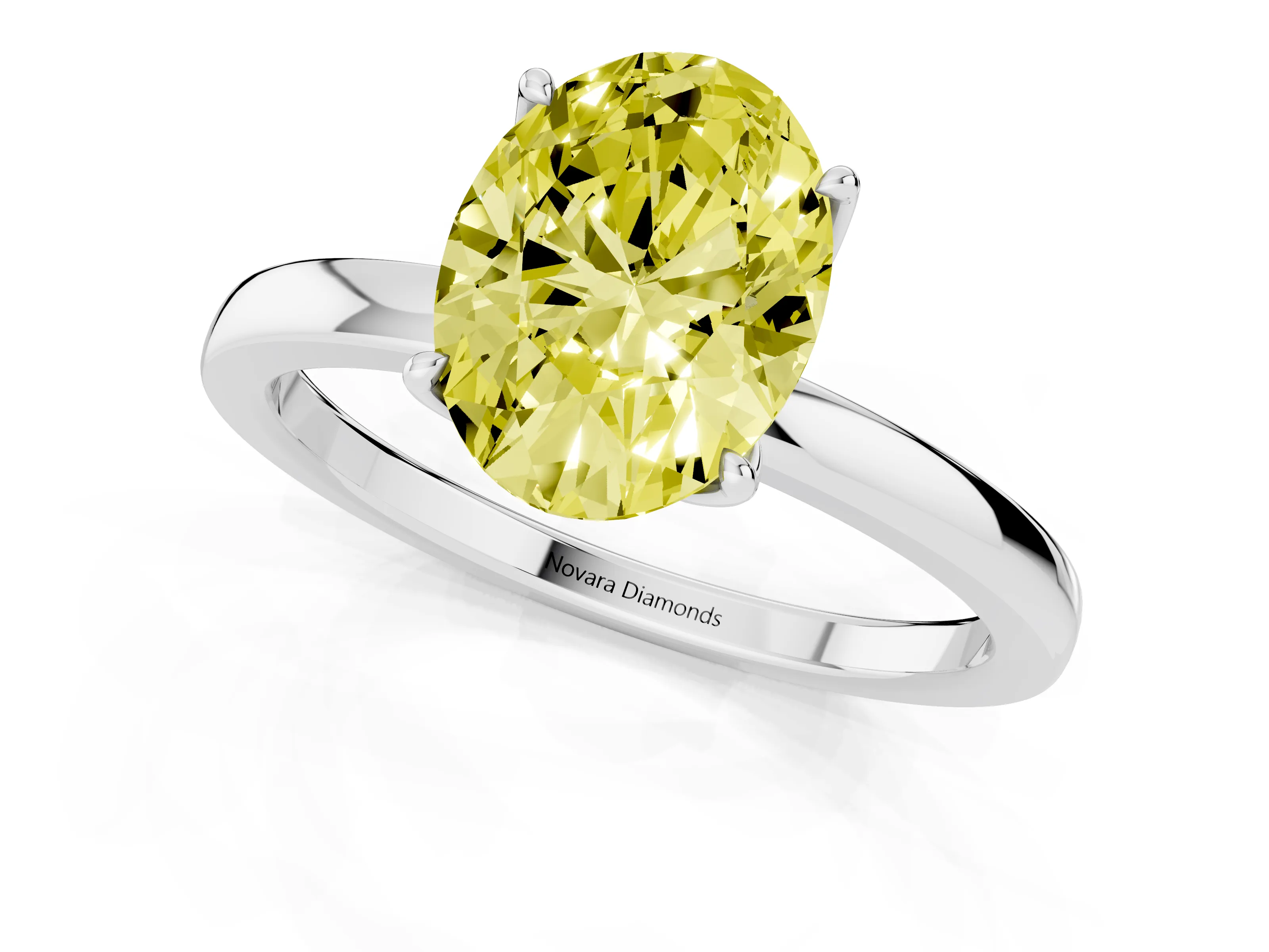 Fancy Yellow Oval Cut Diamond Solitaire Ring Set in White gold with Prong Setting and Thin Polished Band