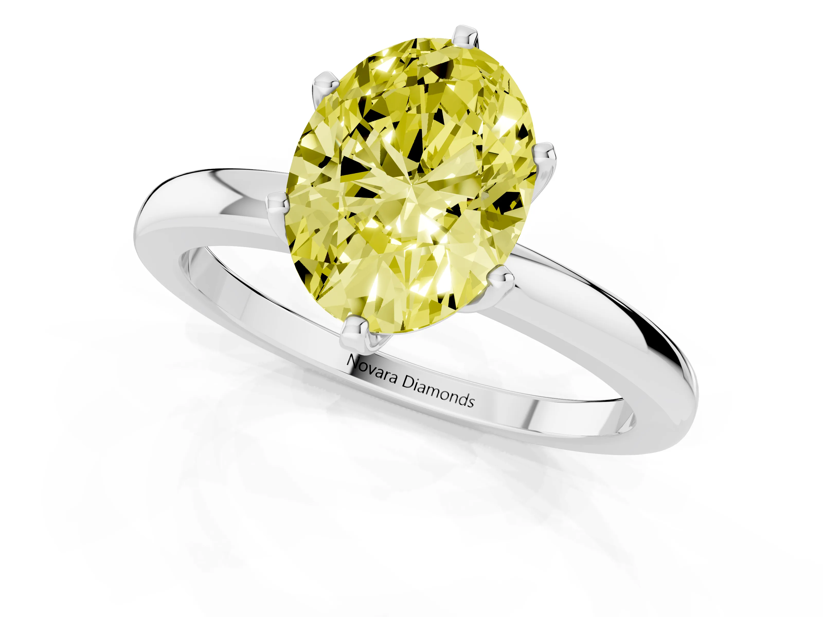 Fancy Yellow Oval Cut Diamond Solitaire Ring Set in White gold with Raised Prong Setting on a Classic Band